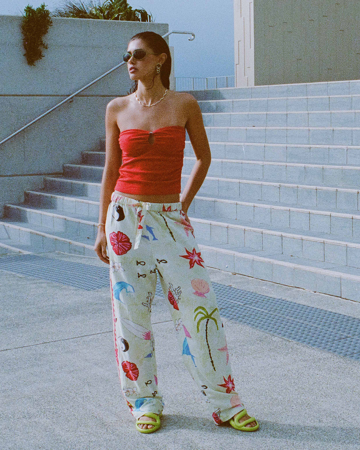 Cream woven pants with colorful floral and botanical print, elastic waistband, relaxed fit.