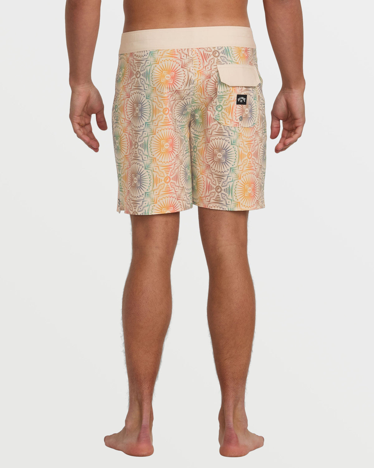 Men's 18" boardshorts with cream waistband and multicolored geometric floral pattern in tan, orange, and green tones.