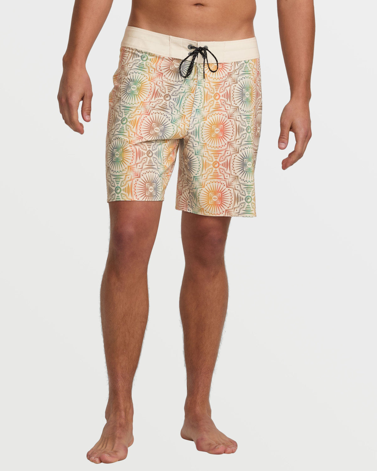 Men's boardshorts with cream waistband, geometric sun and pattern print in orange, green and tan, drawstring tie.