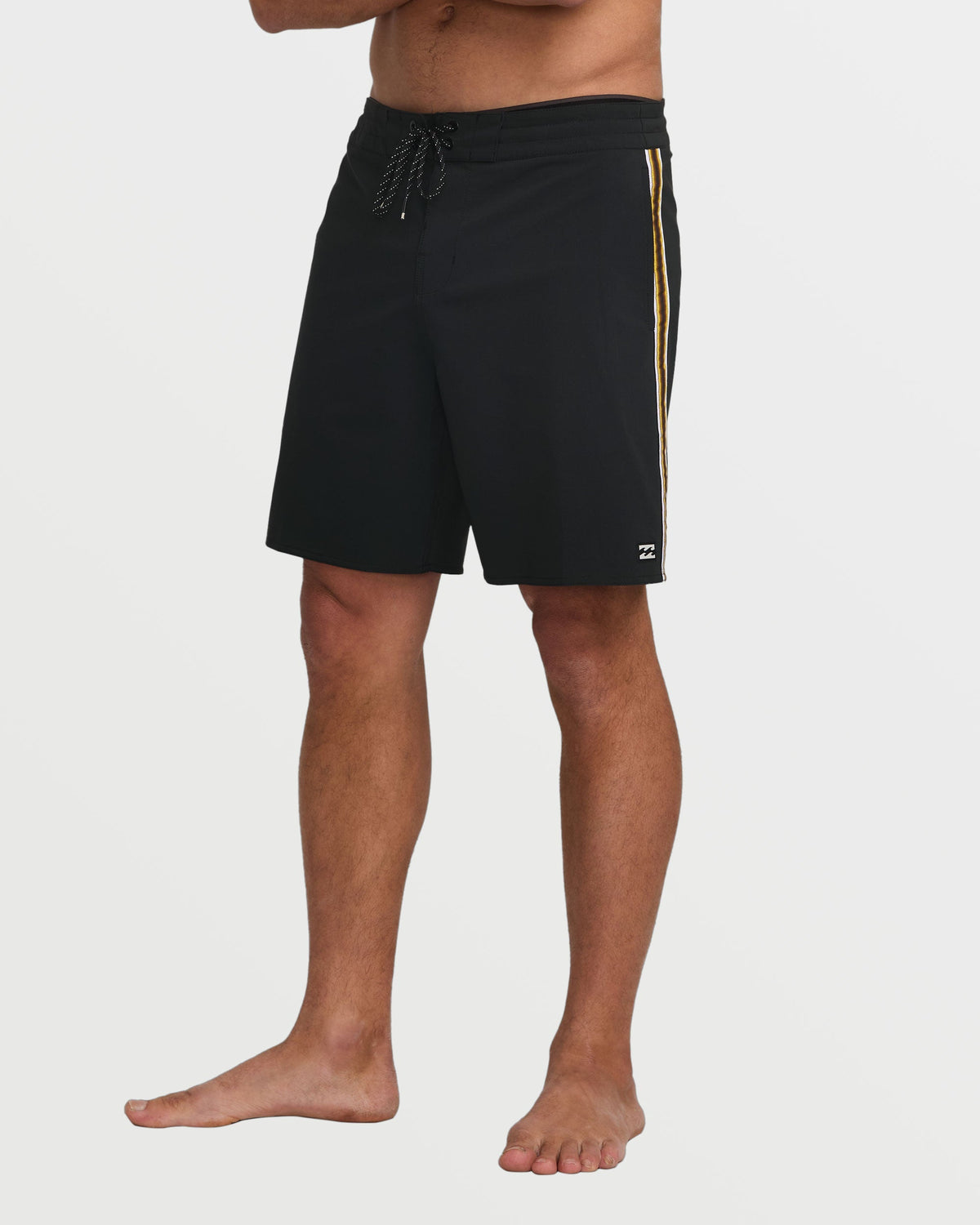 Black boardshorts with gold side stripe and drawstring waist.