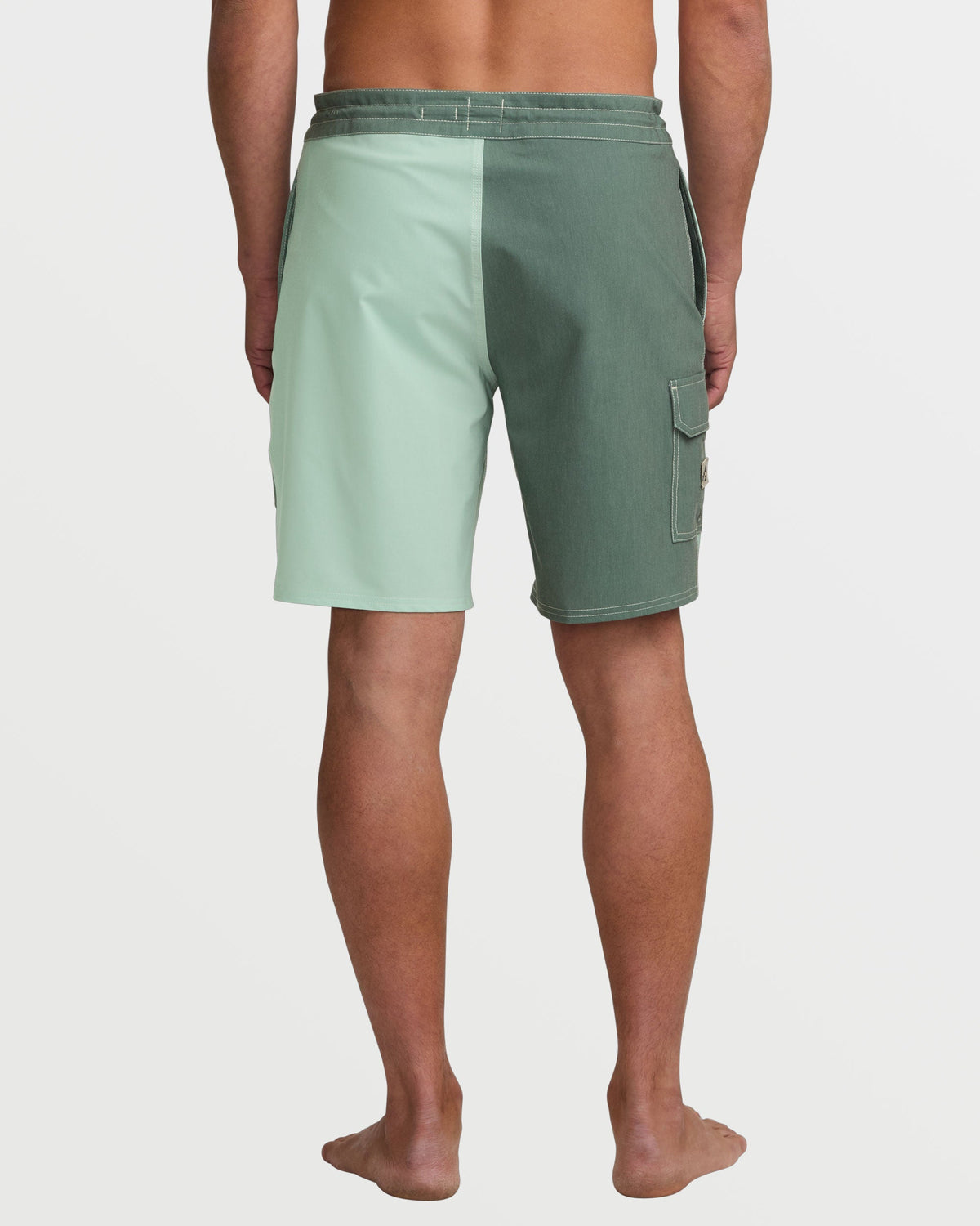 Men's boardshorts with light green and darker green colorblock design, cargo pocket on thigh, back view.
