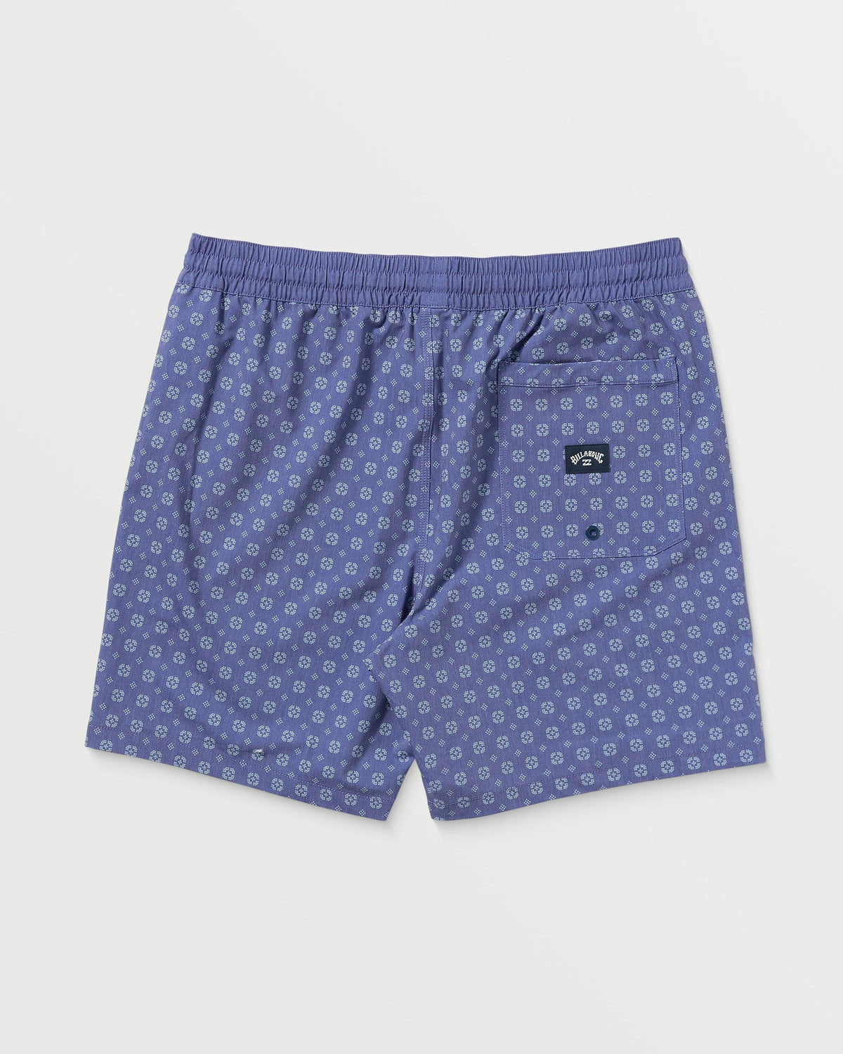 Deep blue swim trunks with small geometric print, elastic waistband, and back pocket patch.