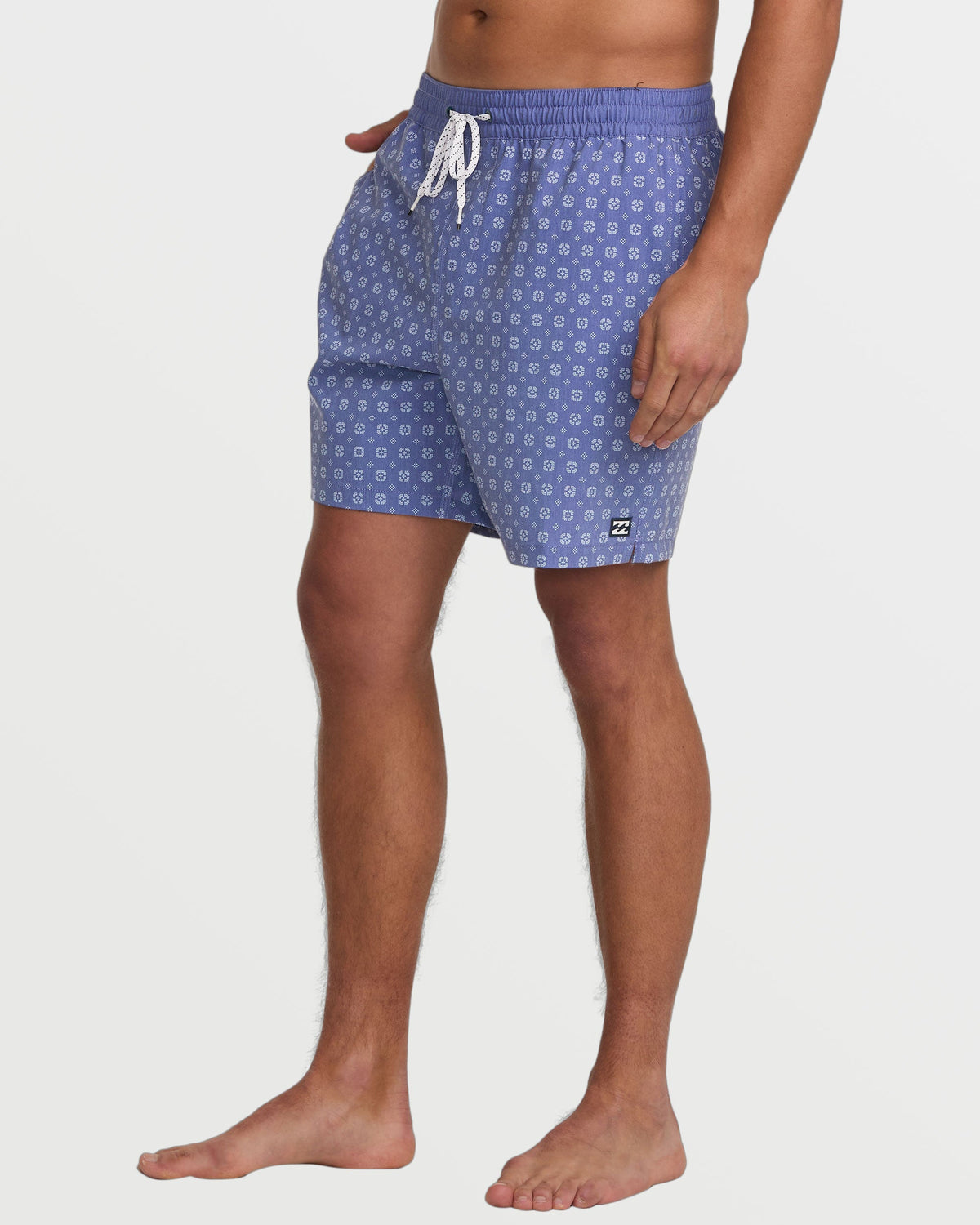 Deep blue swim trunks with small geometric pattern and white drawstring on elastic waistband.