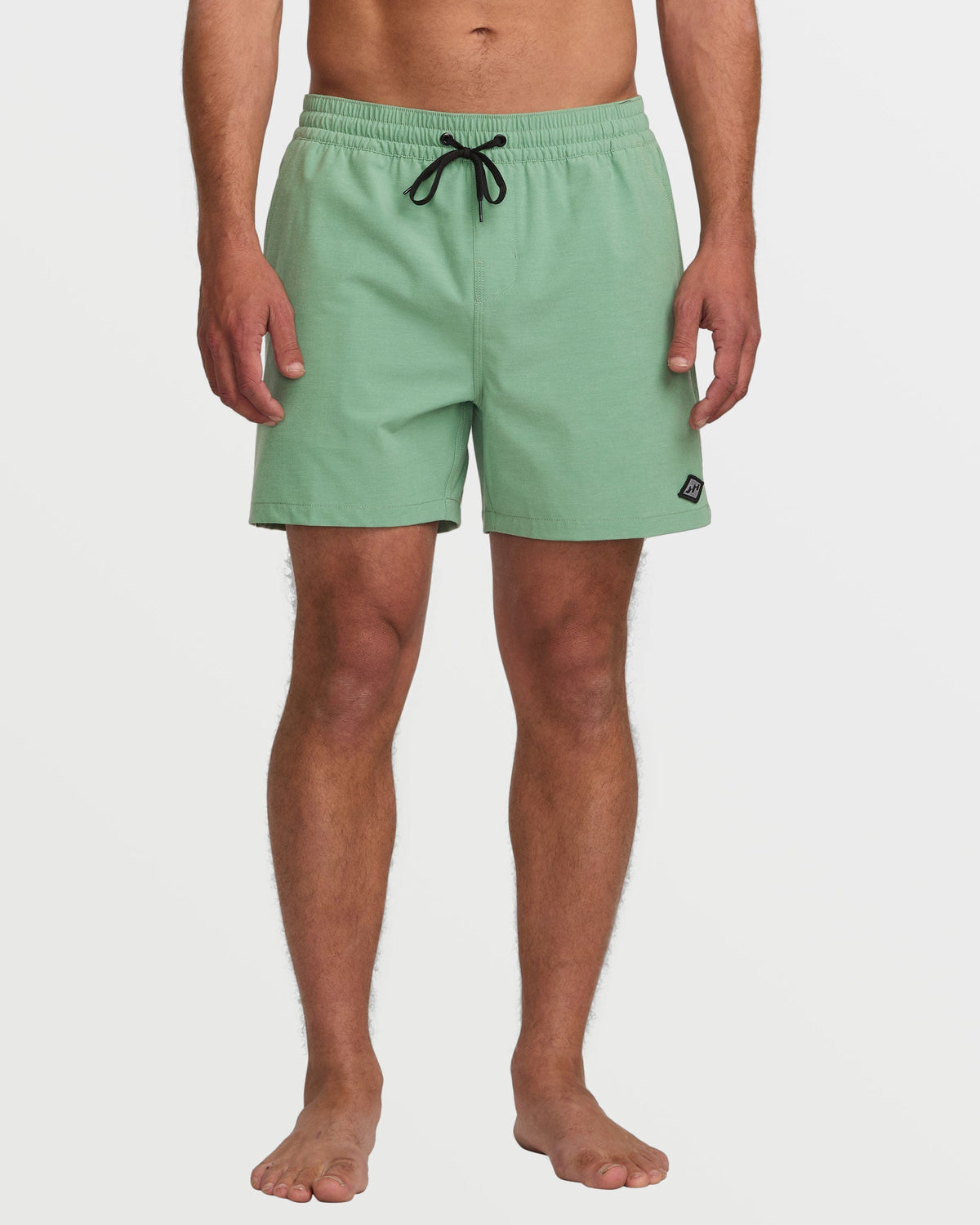 Moss-green 16" swim trunks with black drawstring and small logo patch on hip.