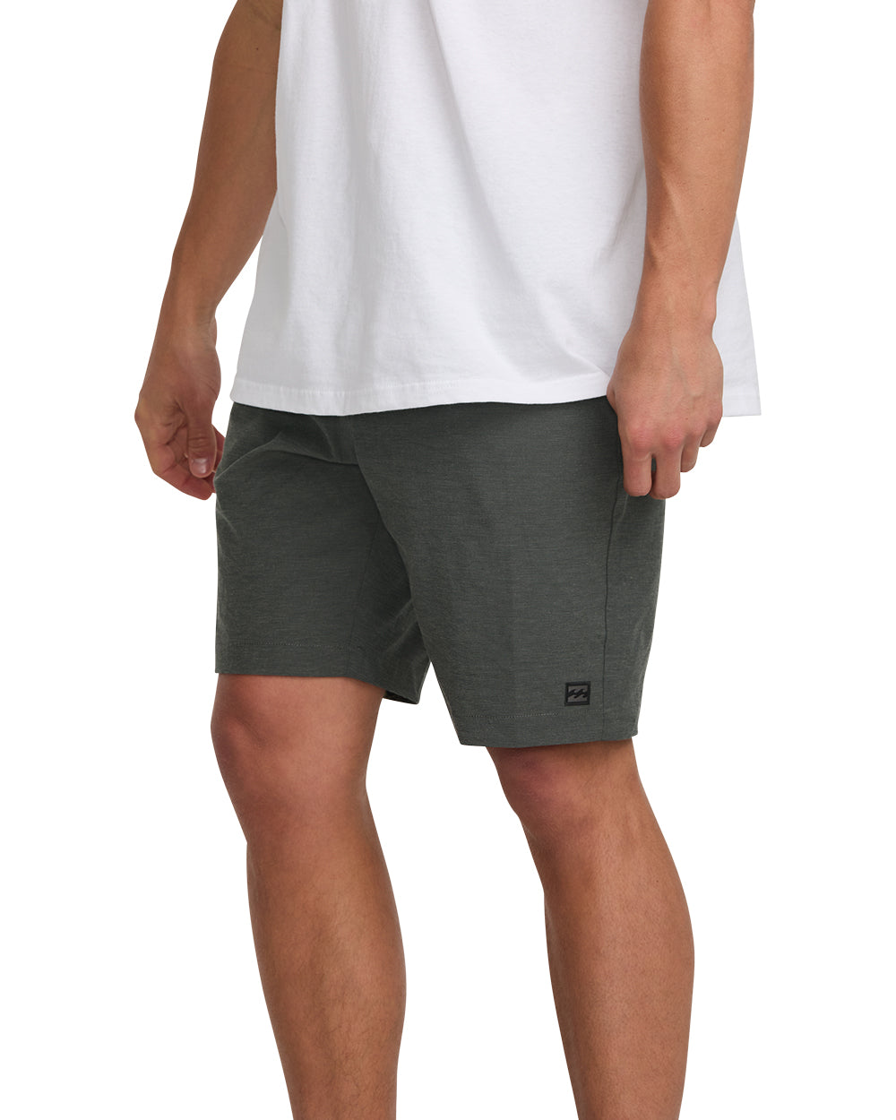 Dark gray hybrid shorts with small brand logo on thigh, shown on male model wearing white t-shirt.