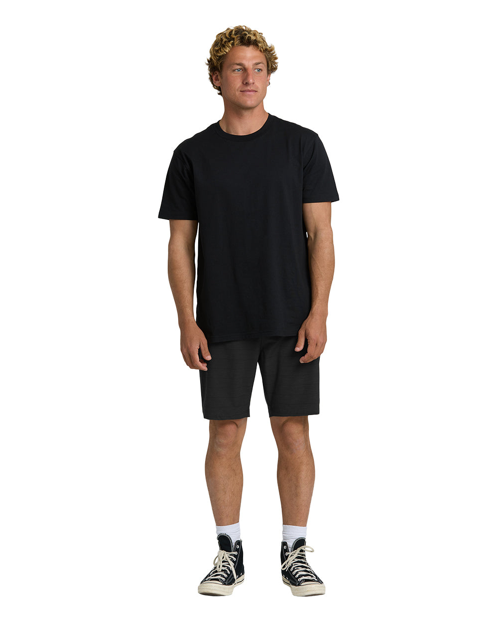 Black hybrid shorts with 19" inseam, displayed on model wearing black t-shirt and canvas sneakers.