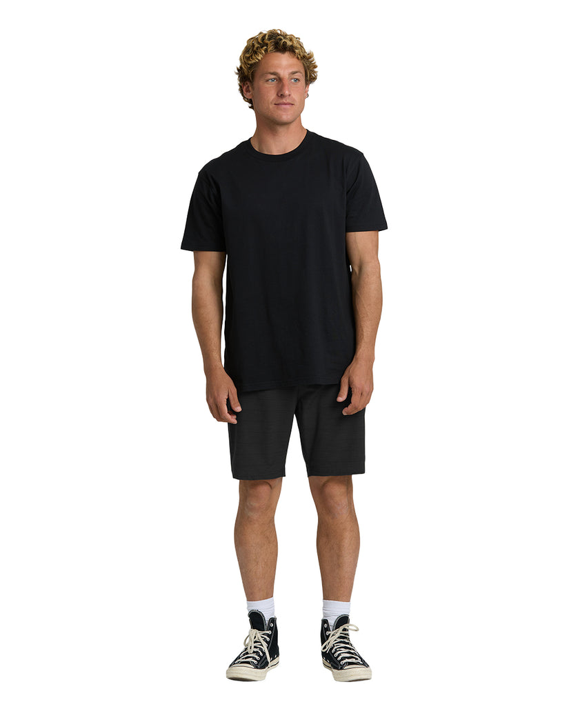 Black hybrid shorts with 19" inseam, displayed on model wearing black t-shirt and canvas sneakers.
