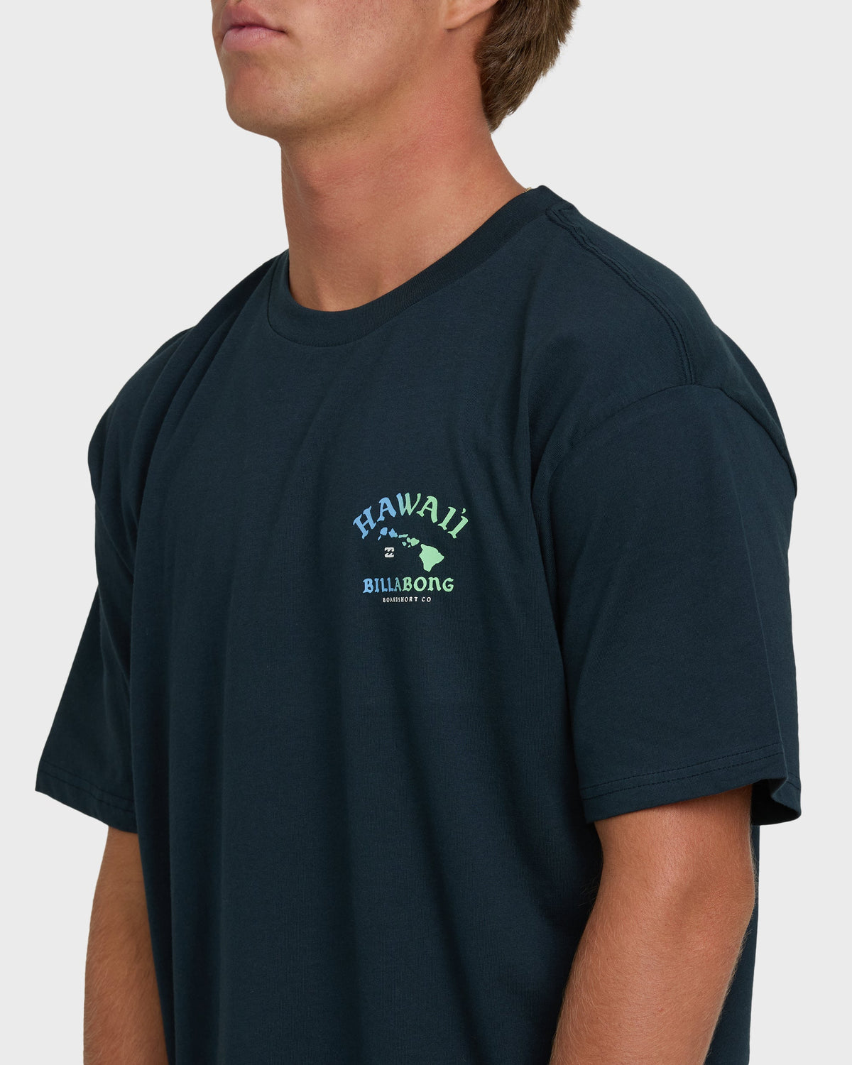 Navy short sleeve t-shirt with Hawaii island chain and Billabong logo graphic on chest.