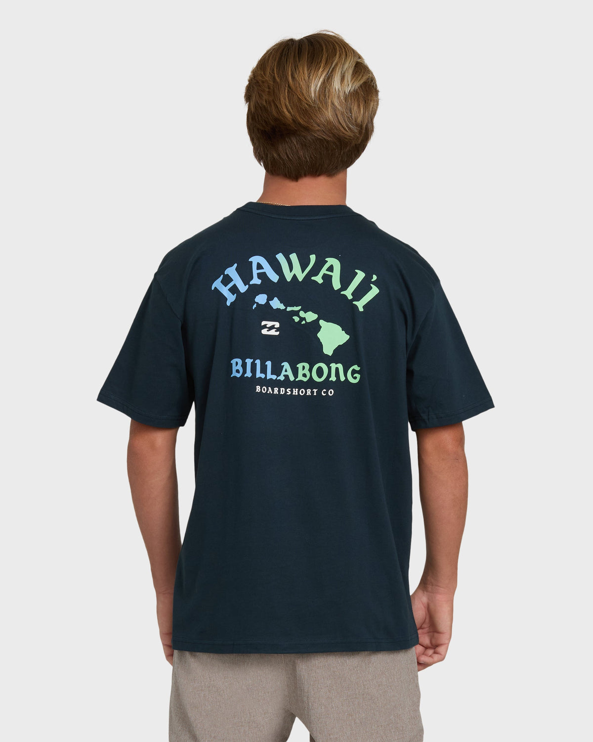 Navy short-sleeve t-shirt with Hawaii island chain graphic and "Billabong Boardshort Co" text on back.