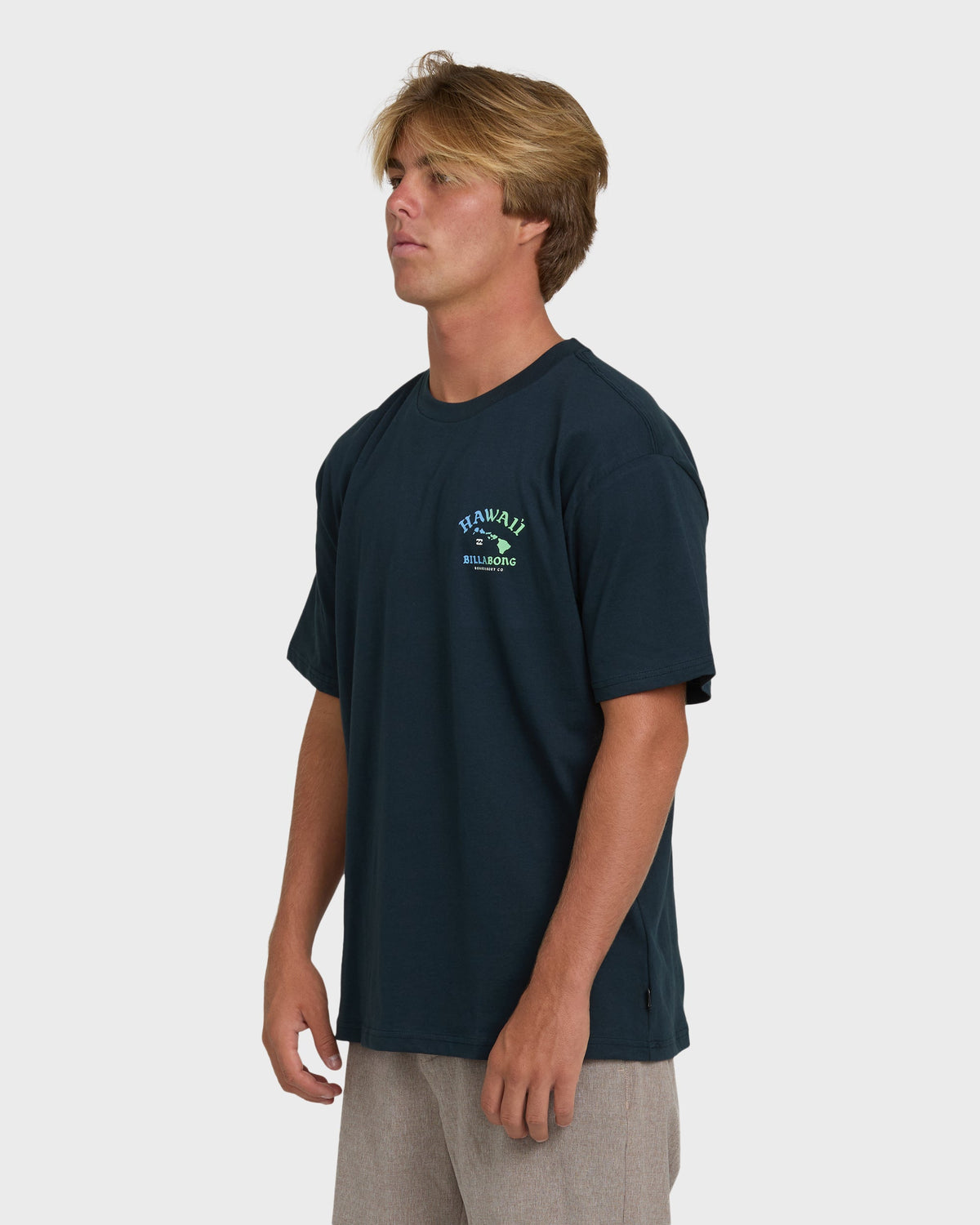 Navy short sleeve t-shirt with small Hawaii and Billabong logo graphic on chest.