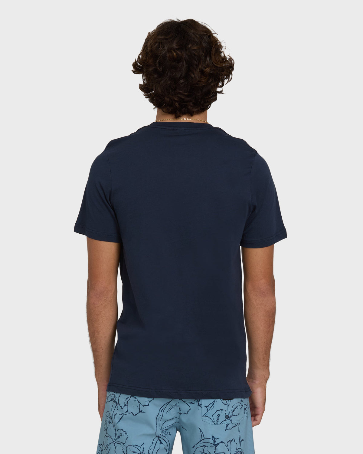 Navy short-sleeve t-shirt with solid front and back displayed on model.