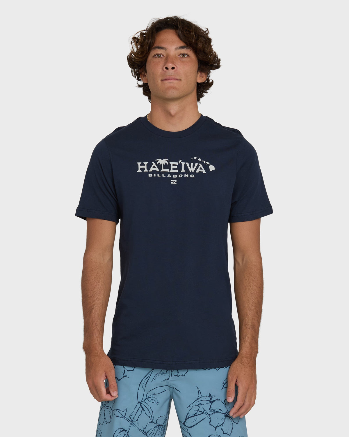 Navy short sleeve t-shirt with "Haleiwa Billabong" text and palm tree graphic on chest.