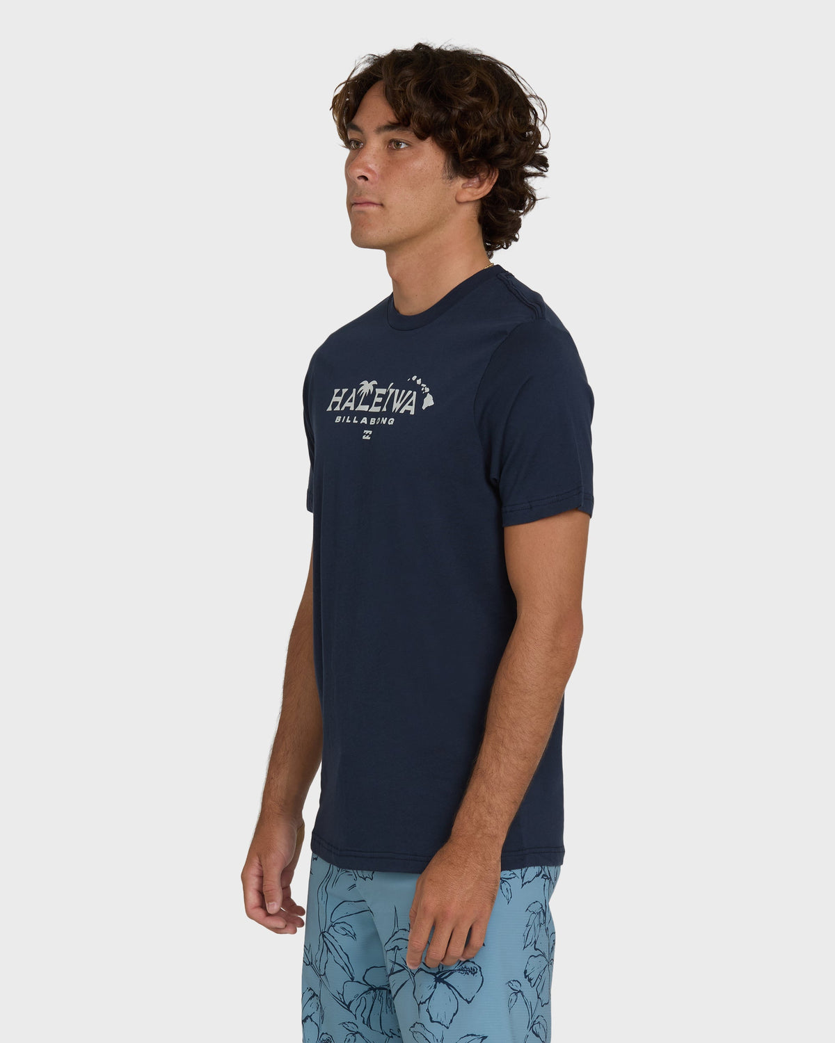 Navy short-sleeve t-shirt with "Haleiwa Billabong" text and palm graphic on chest.