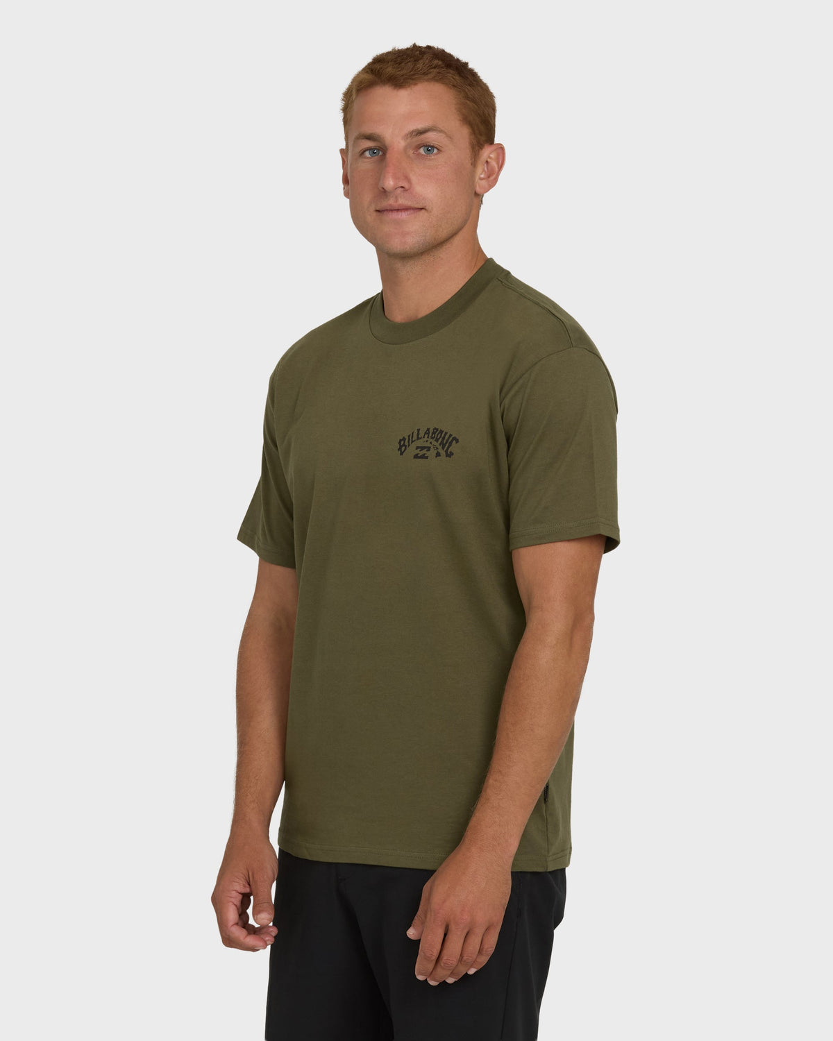 Military green short sleeve t-shirt with small chest logo, worn by model.
