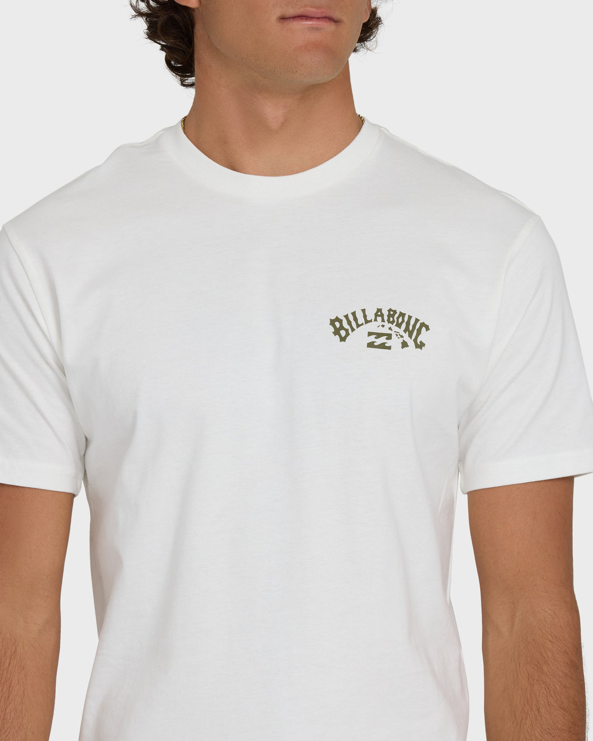 Off-white short sleeve t-shirt with small "Billabong" logo on chest.