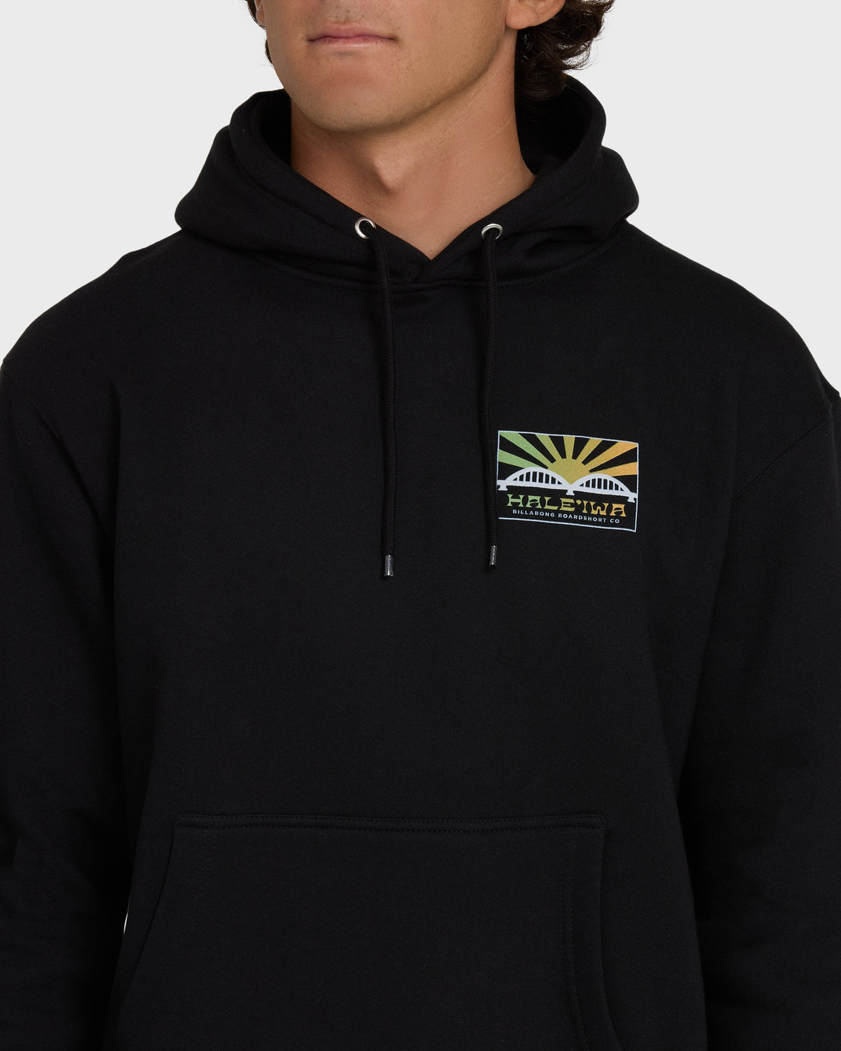 Black pullover hoodie with Haleiwa Rising Sun graphic patch on chest and front kangaroo pocket.