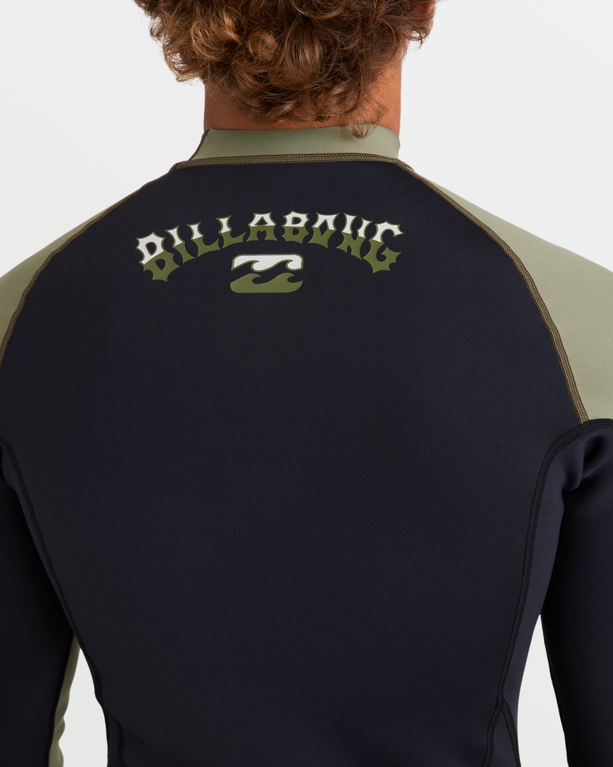 Black and olive long sleeve wetsuit jacket with Billabong logo on back and contrasting shoulder panels.