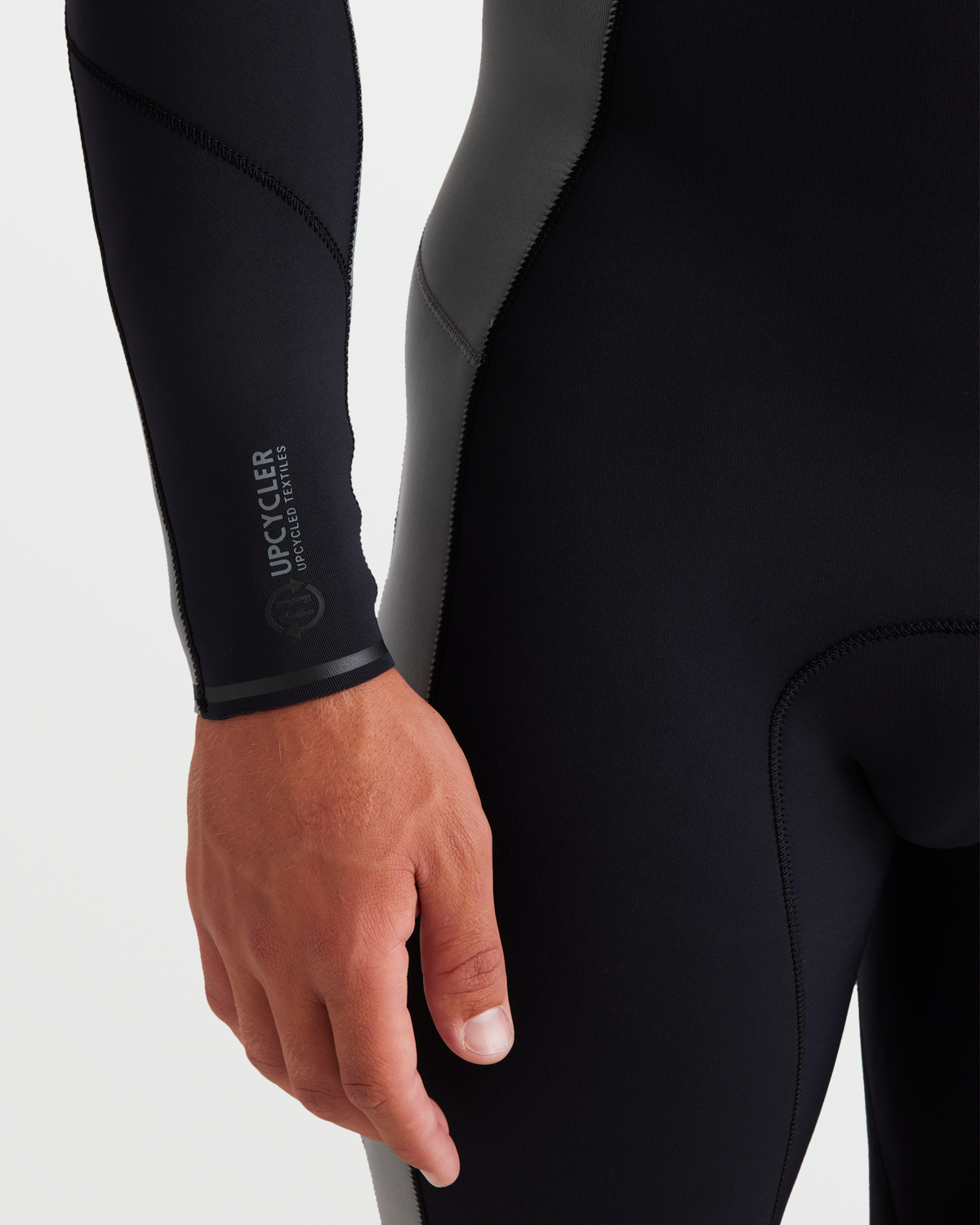 Black and gray neoprene wetsuit with contrasting gray side panels and brand text visible on sleeve.