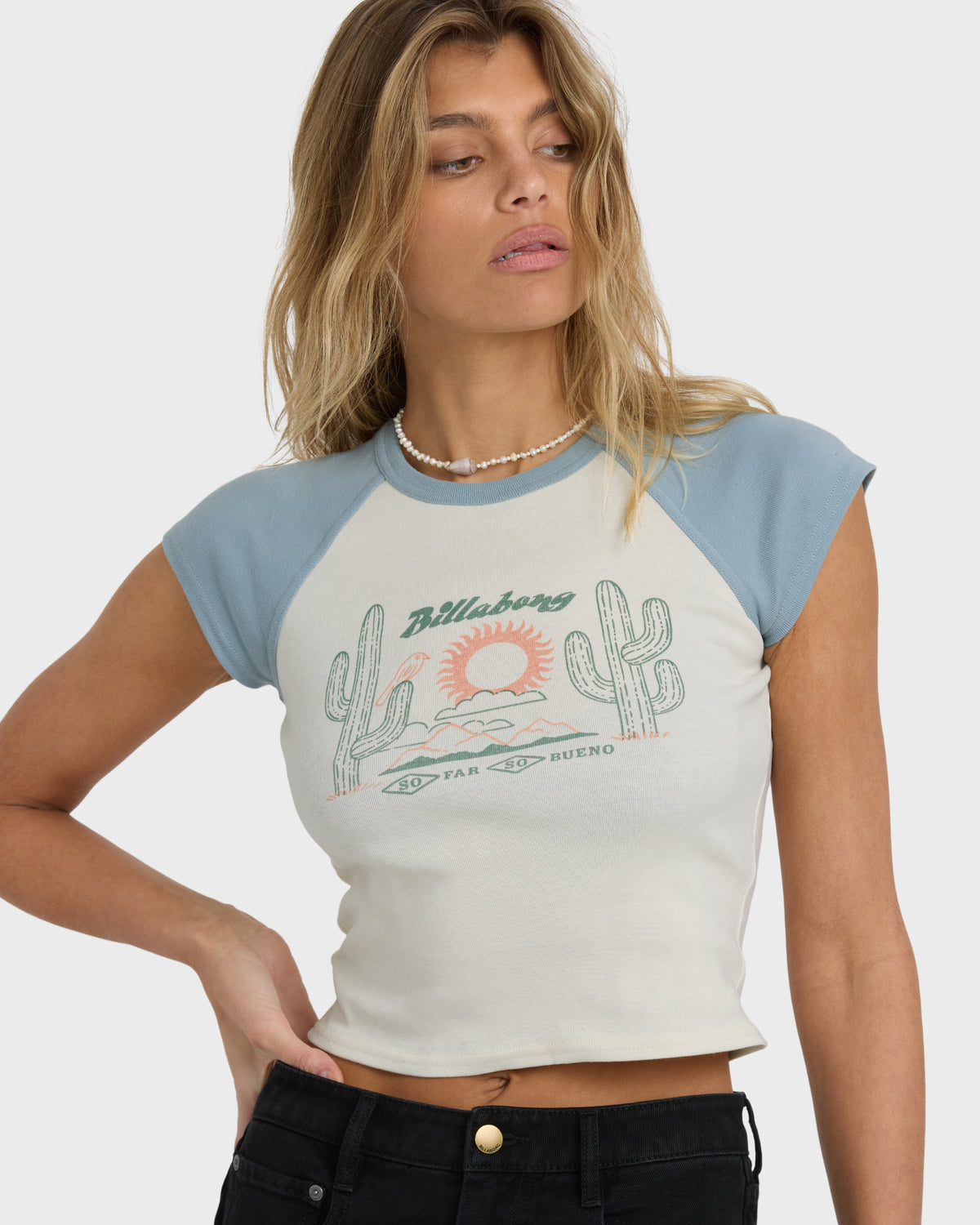 Mineral blue and cream short sleeve raglan tee with cactus and sun graphic on front.