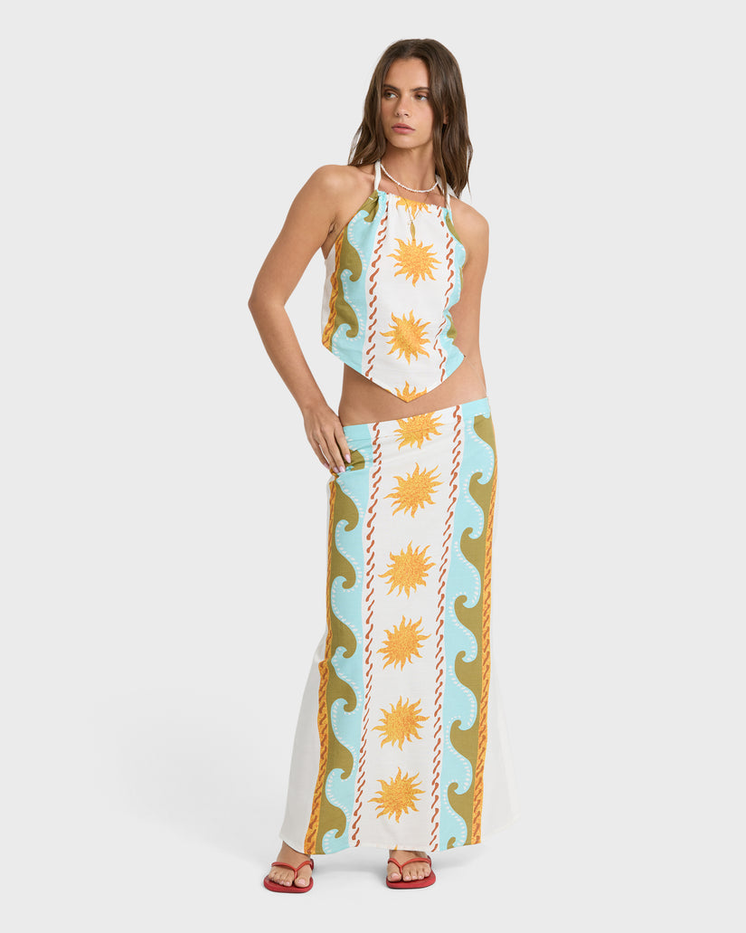 Woven halter top with sun and wave print in cream, blue, and gold tones paired with matching maxi skirt.