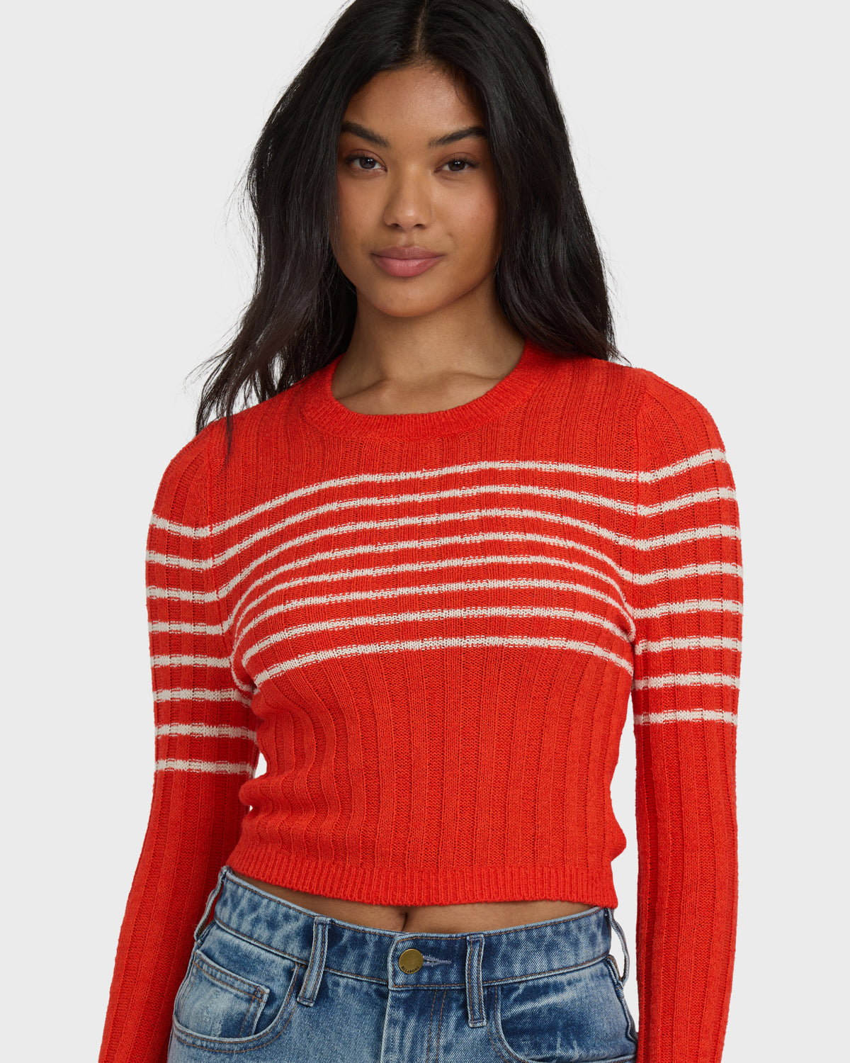 Red ribbed sweater with white horizontal stripes across chest and sleeves, cropped length, crew neckline.