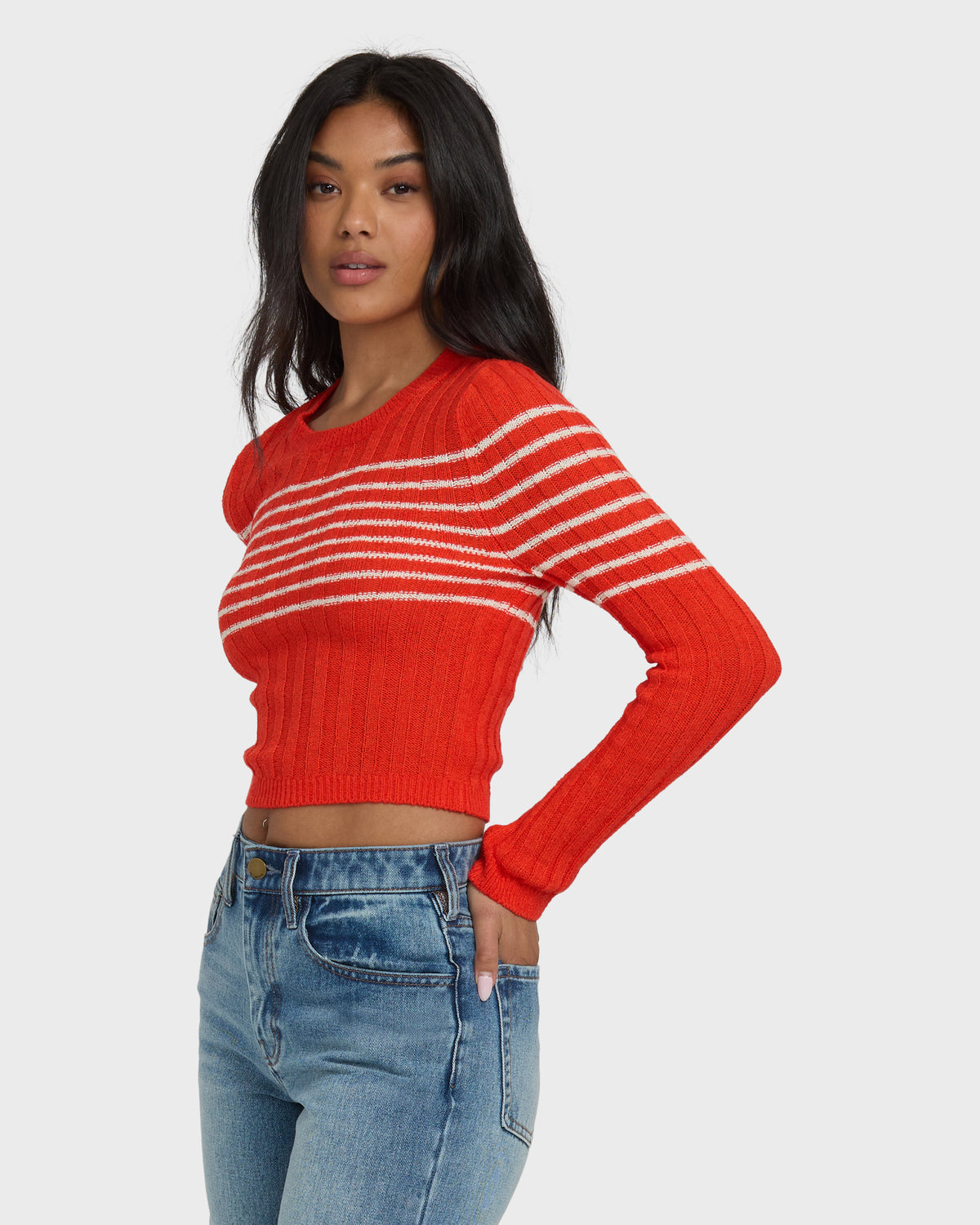 Red ribbed sweater with white horizontal stripes across the chest and long sleeves.