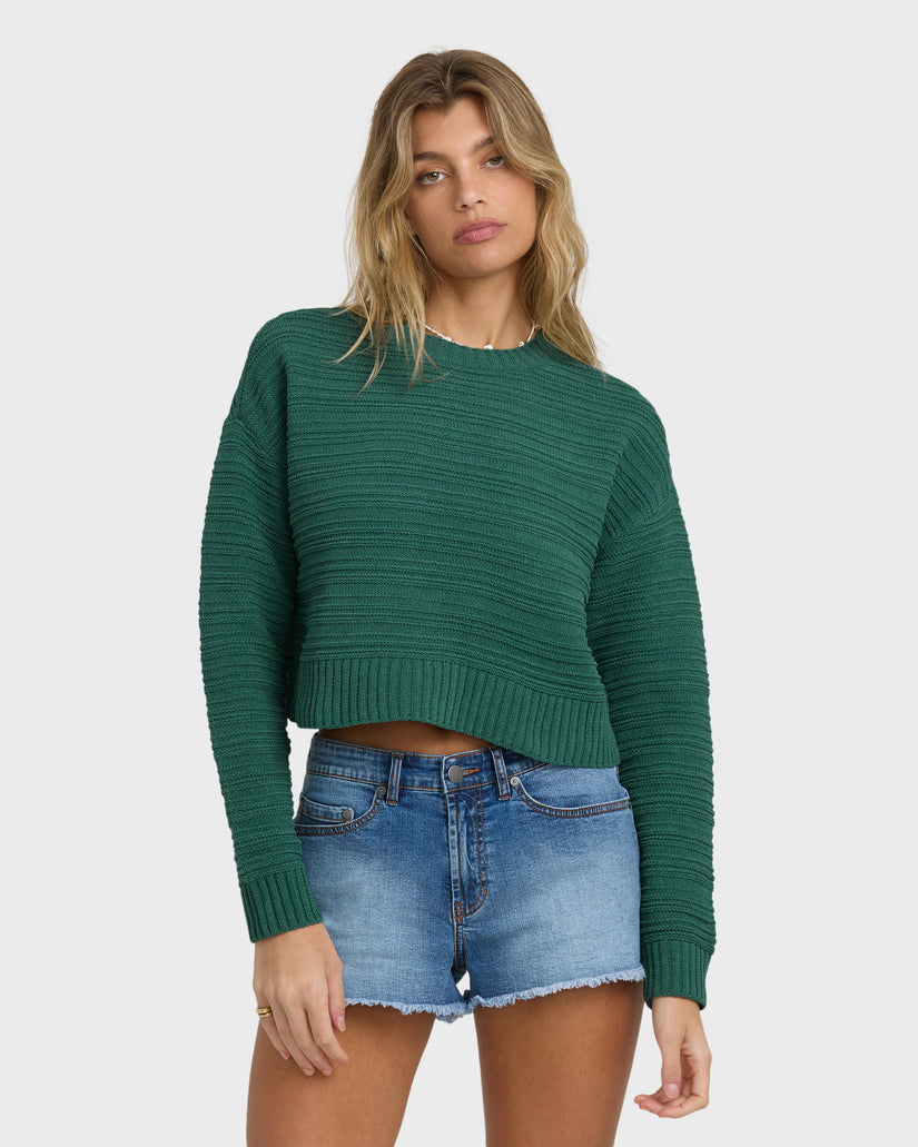 Green ribbed crewneck sweater with long sleeves and cropped hem.