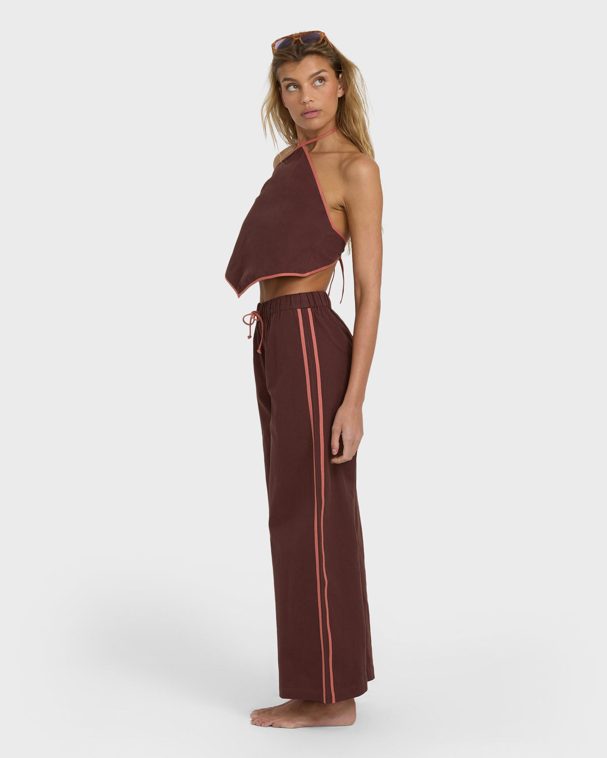Teak elastic waist pants with side stripes and drawstring, shown with matching halter top.