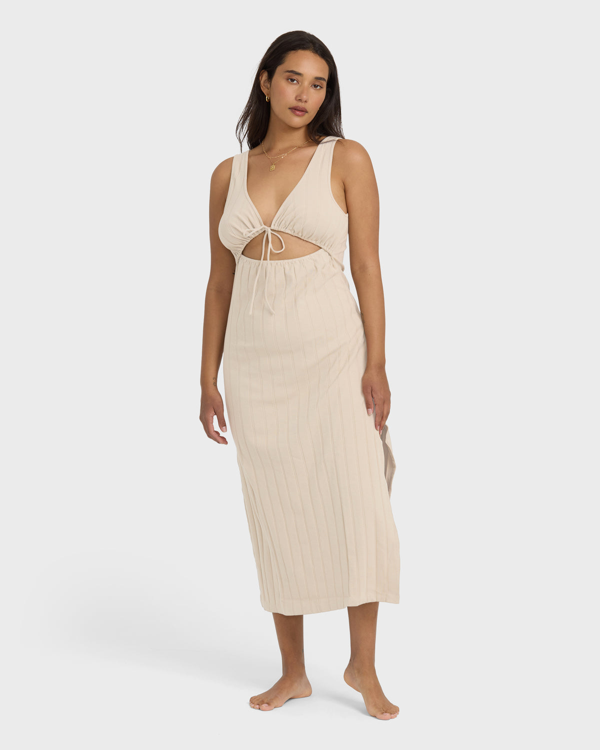 Cream ribbed knit midi dress with cutout detail and tie-front neckline on model.