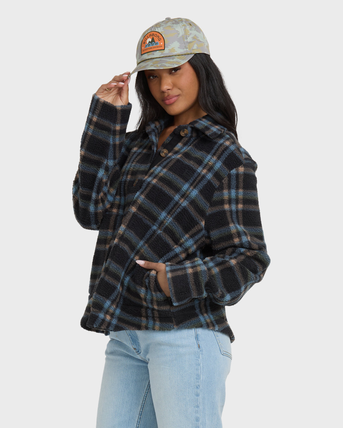 Black plaid sherpa shacket with button front, chest pockets, and long sleeves.