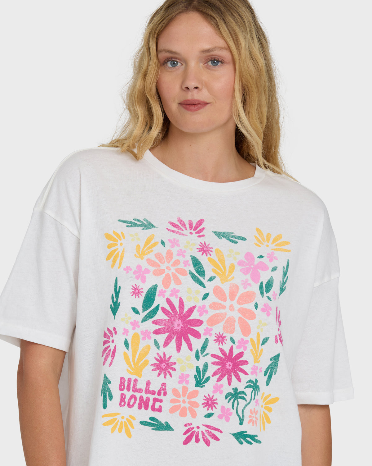 Salt crystal short sleeve t-shirt with multicolored floral and leaf print graphic on chest.