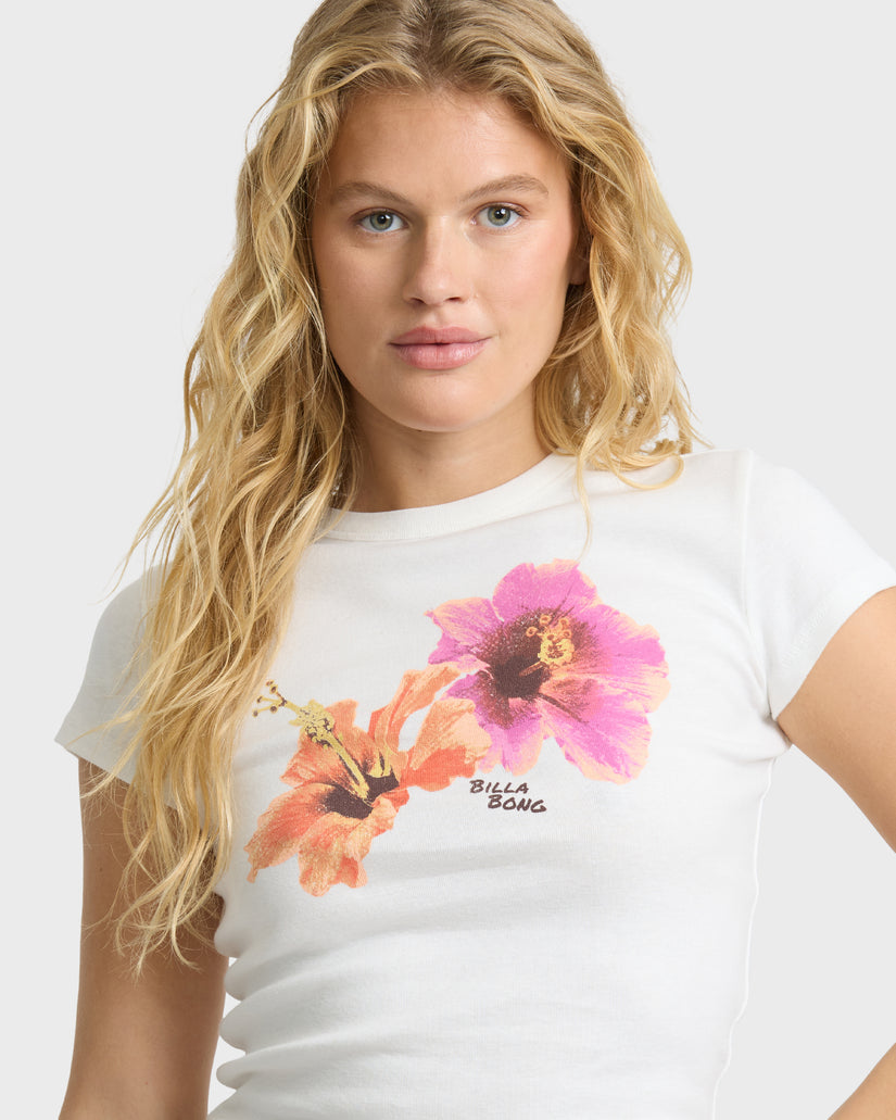 White short sleeve t-shirt with pink and orange flower graphic and "Billabong" text on chest.