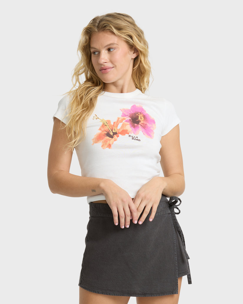 White short sleeve t-shirt with pink and orange flower graphic and text print on chest.