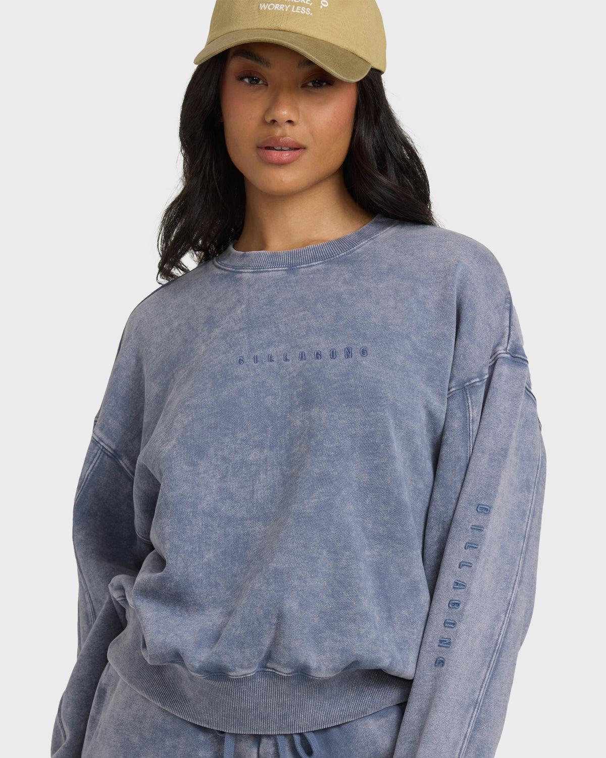 Stone blue saltwashed crewneck sweatshirt with embroidered text on chest and sleeve.