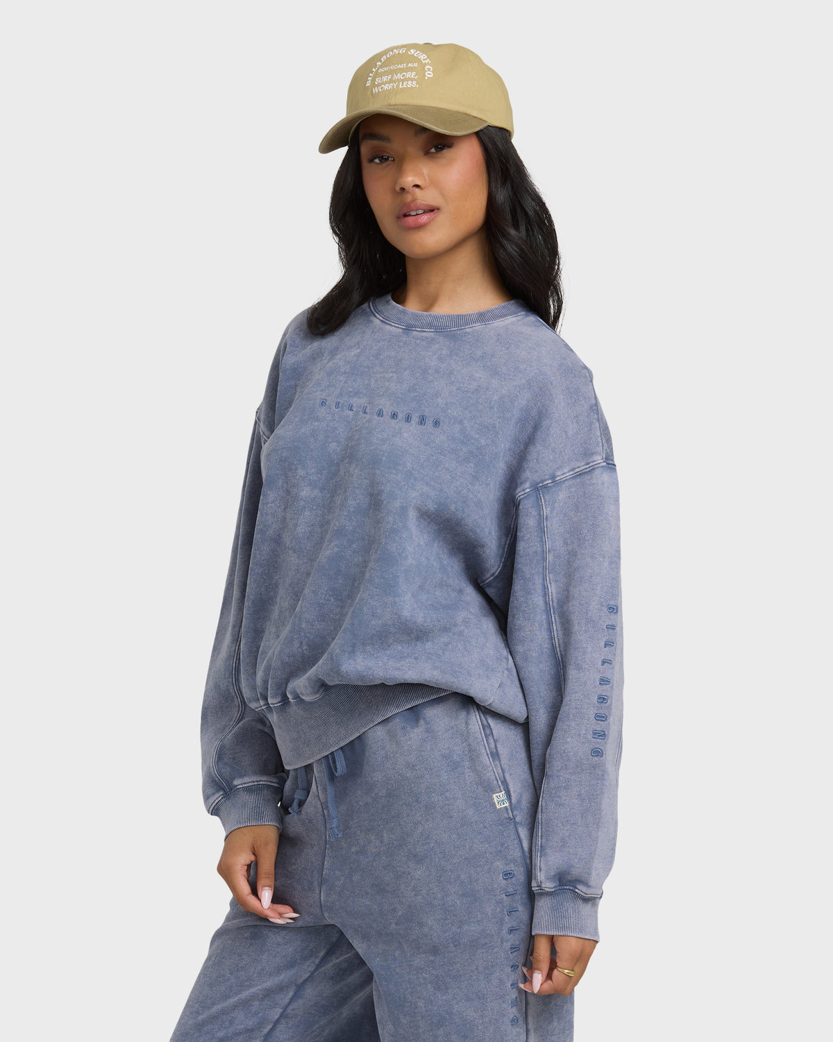 Stone blue saltwashed crewneck sweatshirt with embroidered text on chest and sleeve.