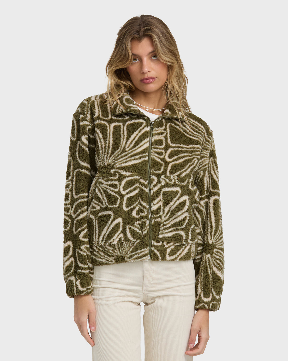 Martini olive sherpa fleece jacket with cream abstract leaf pattern and front zip closure.