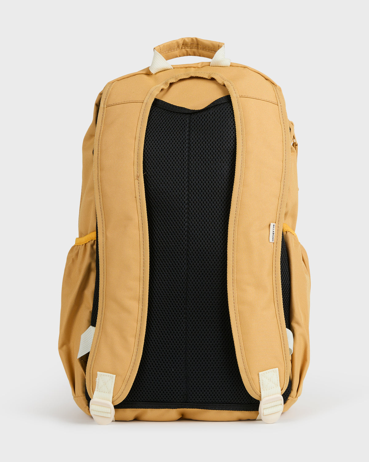 Honey-colored backpack with padded shoulder straps, cream-colored trim, and black mesh back panel.