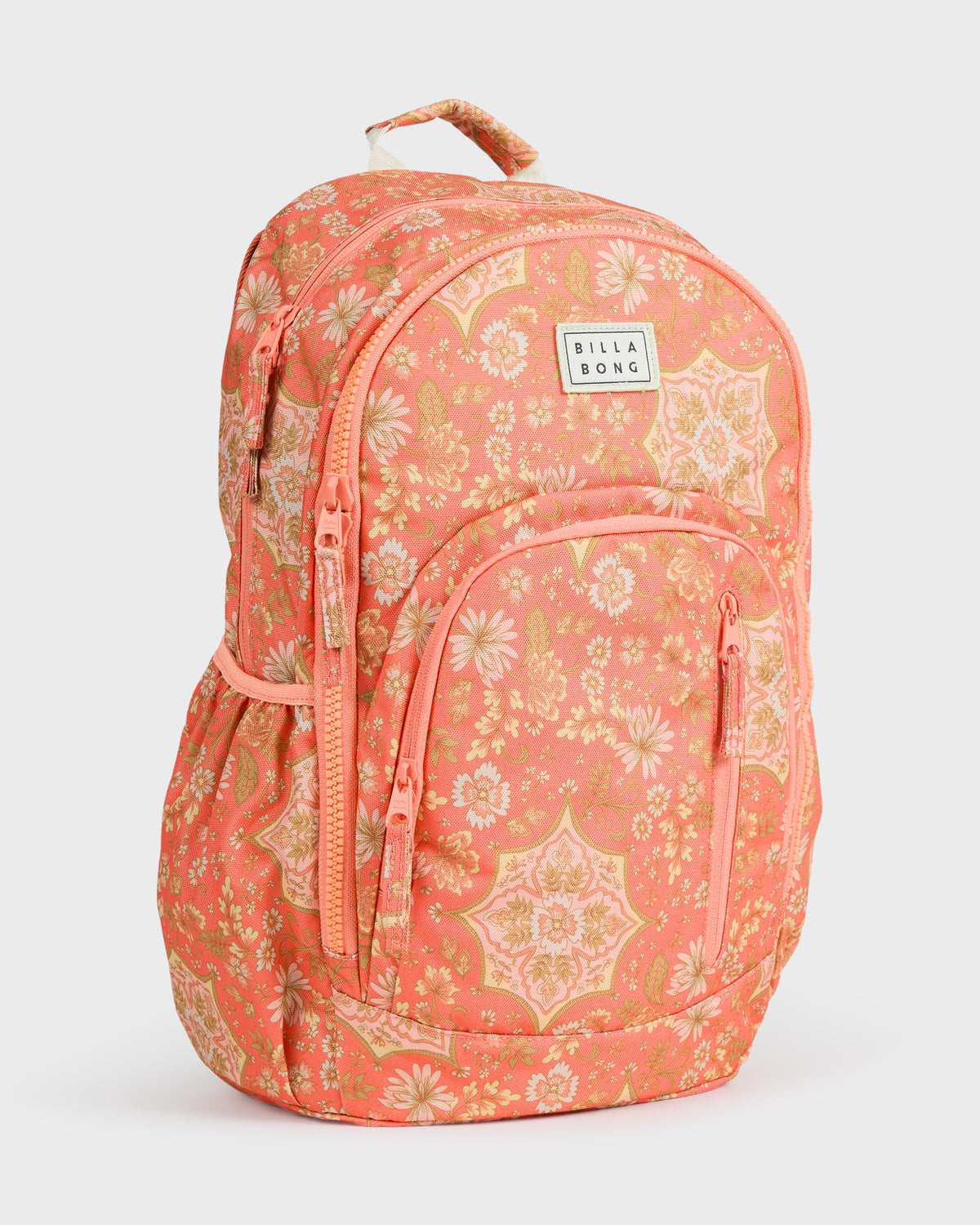 Coral backpack with floral and geometric pattern, front zippered pockets, padded straps, and Billabong branded patch.