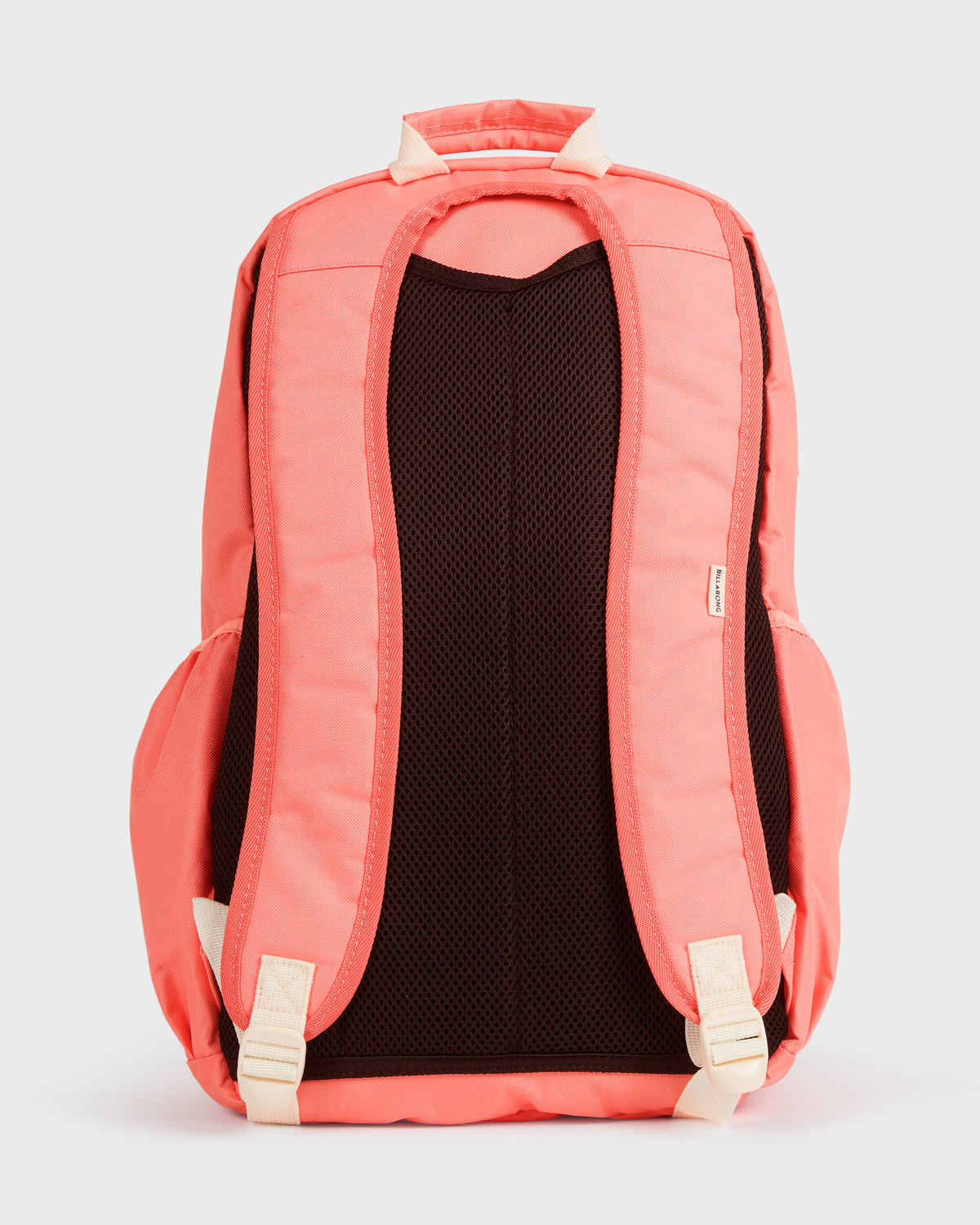 Coral-colored backpack with cream shoulder straps and black mesh back panel, shown from rear view.