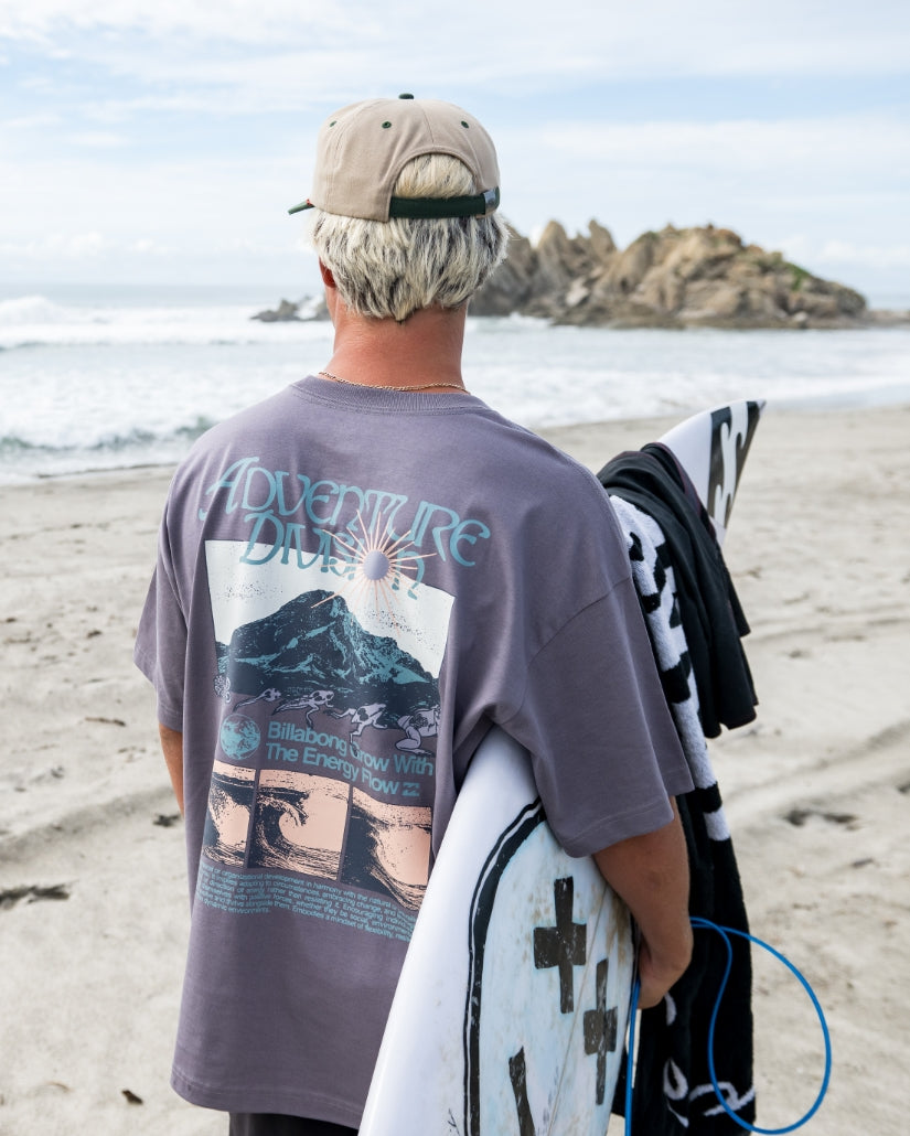 Grey violet short sleeve t-shirt with "Adventure Awaits" graphic and mountain landscape design on back.