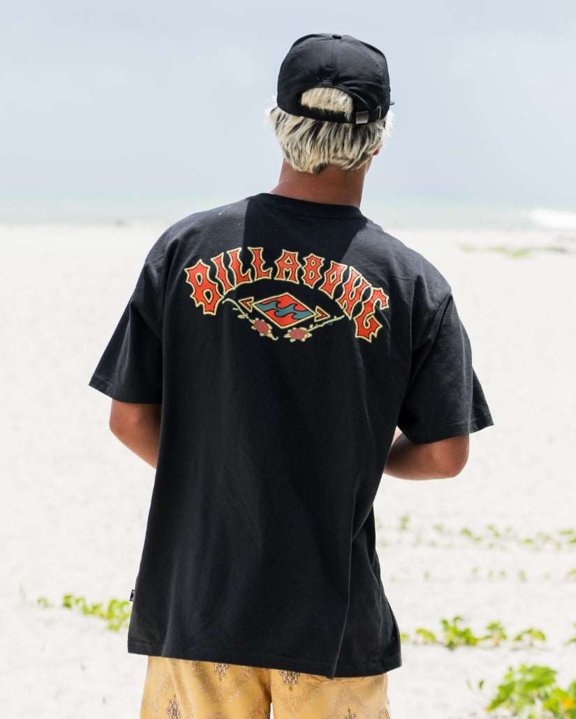 Washed black short sleeve t-shirt with red and yellow "Billabong" text and graphic design on back.