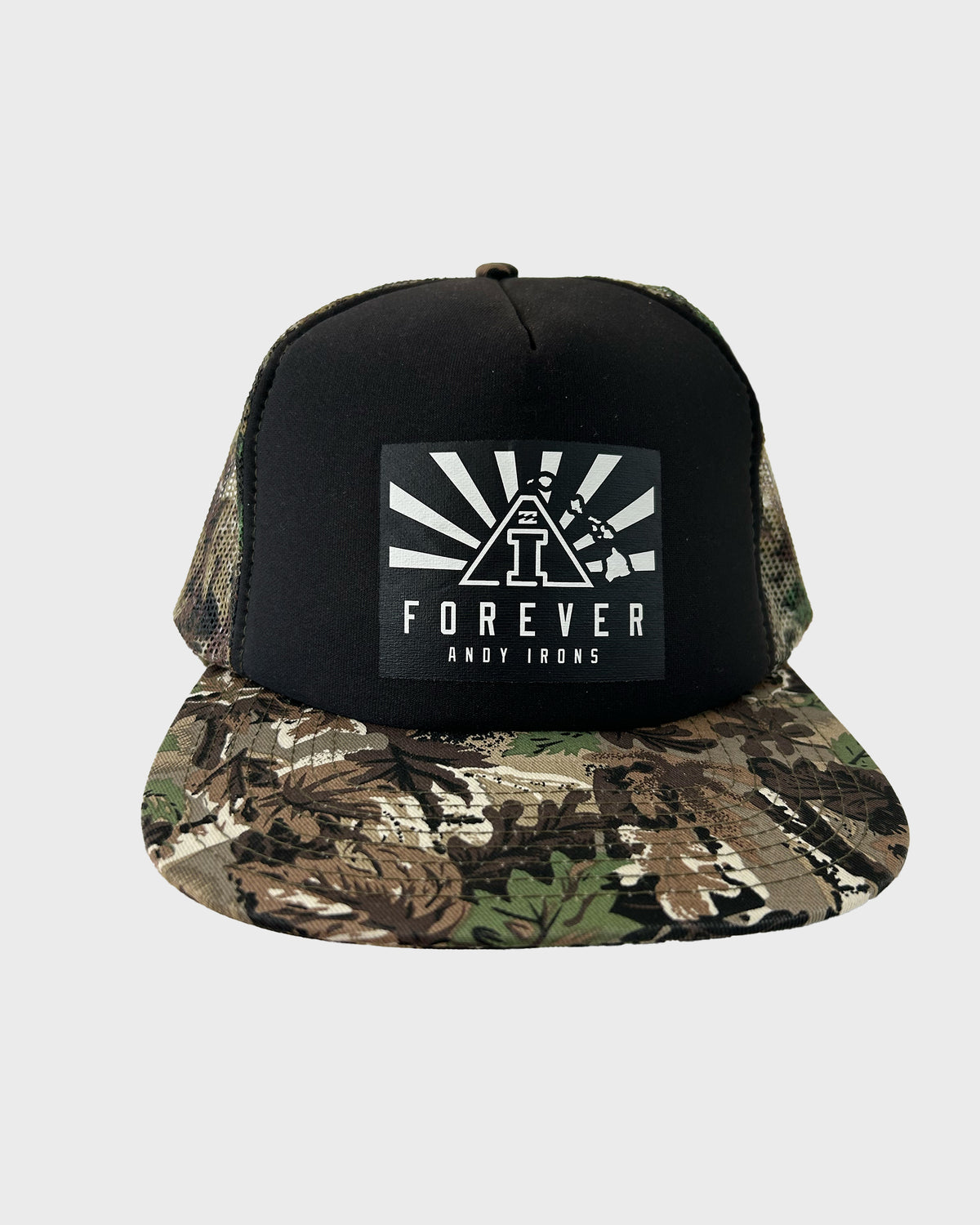 Black trucker hat with camouflage brim and white "Forever Andy Irons" graphic patch on front.