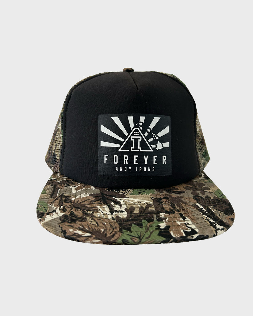 Black trucker hat with camouflage brim and white "Forever Andy Irons" graphic patch on front.