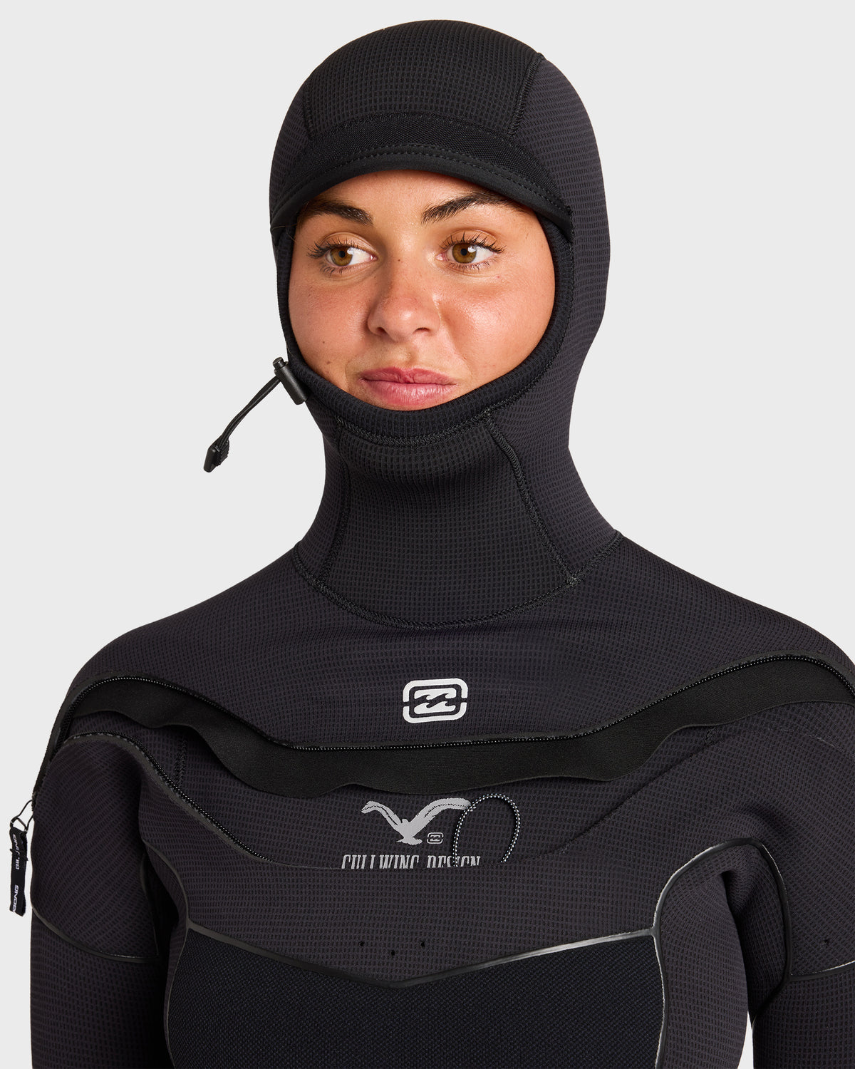 Black hooded chest zip full wetsuit with attached hood and drawstring closure shown on model.