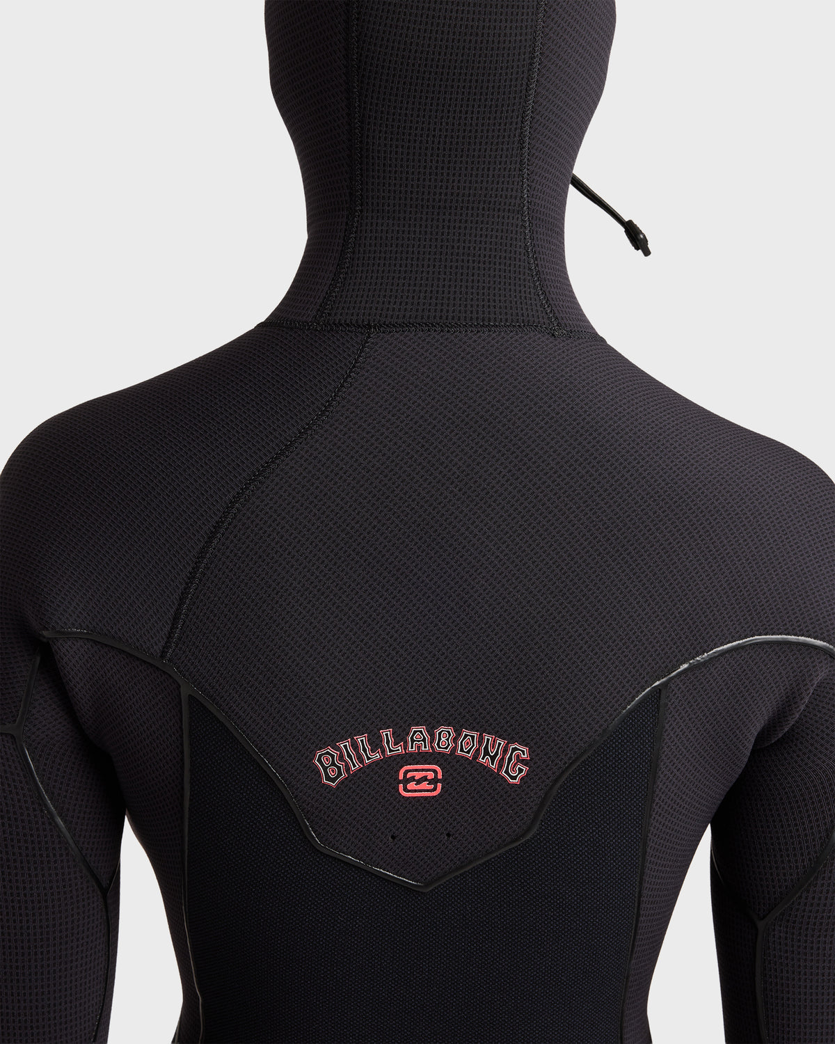 Black full-length wetsuit with hooded chest zip closure and Billabong branding on back.