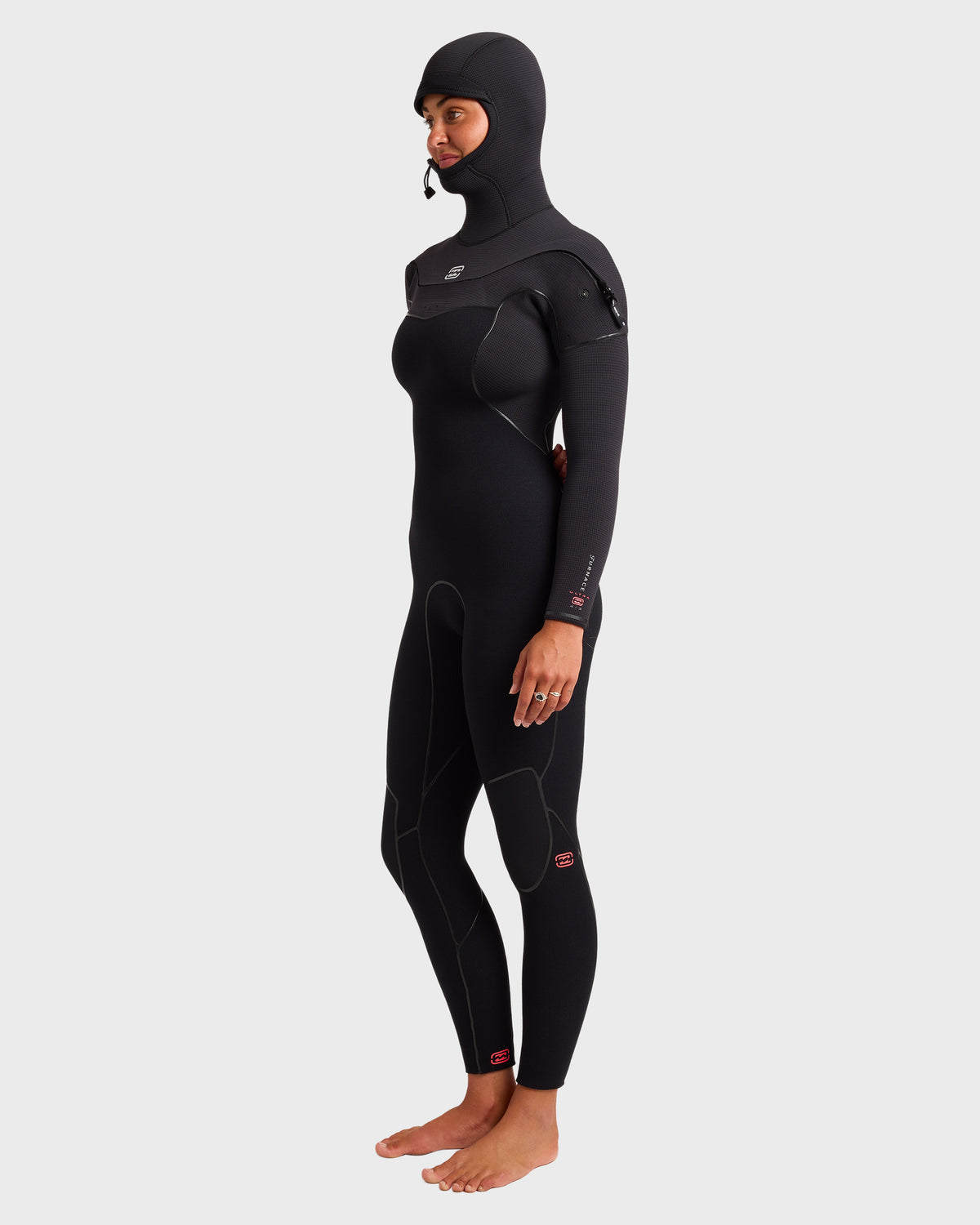 Black full-length wetsuit with attached hood, chest zip closure, and long sleeves on model.