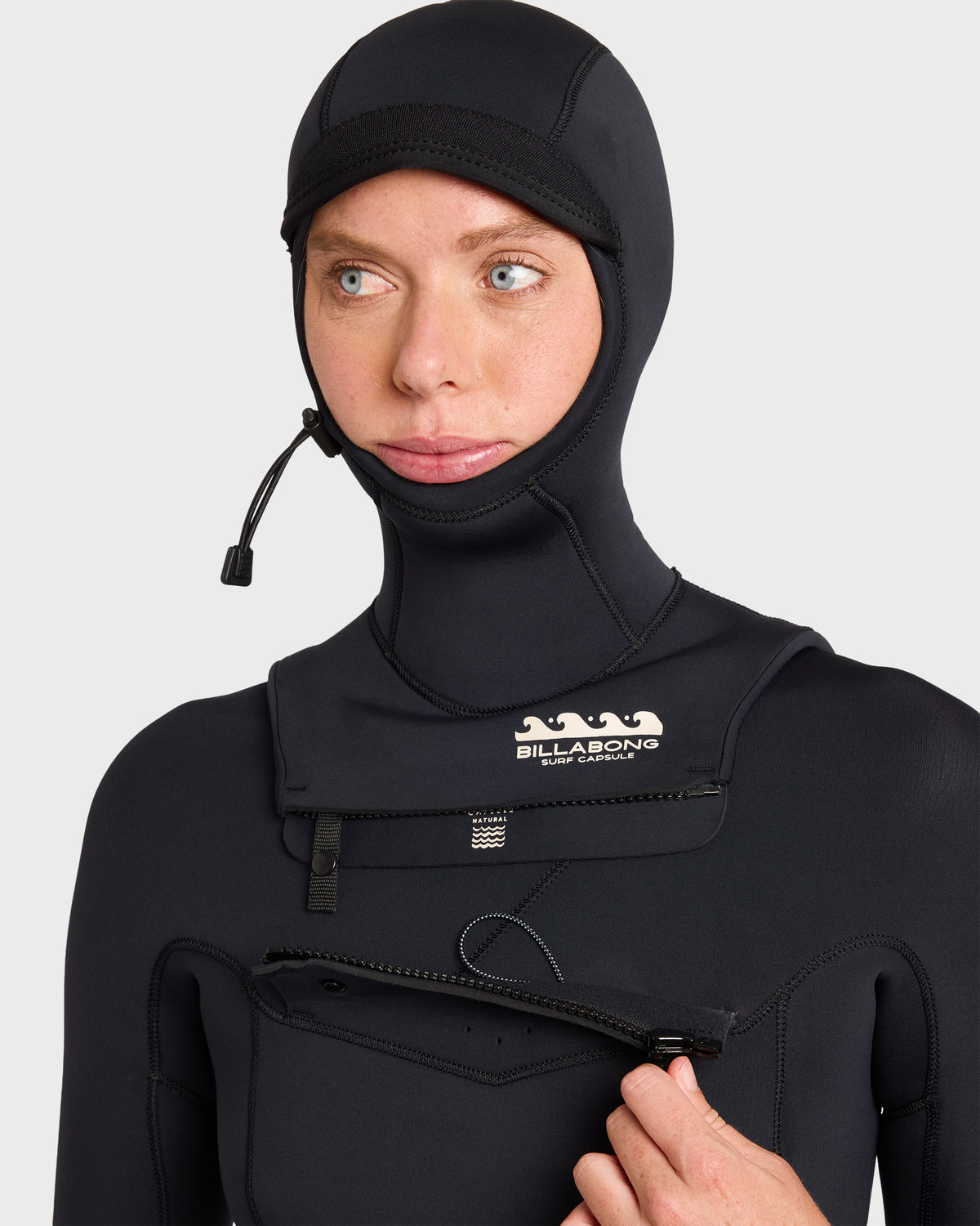 Black full wetsuit with hood and chest zip closure, featuring reinforced seams and drawstring hood cinch.