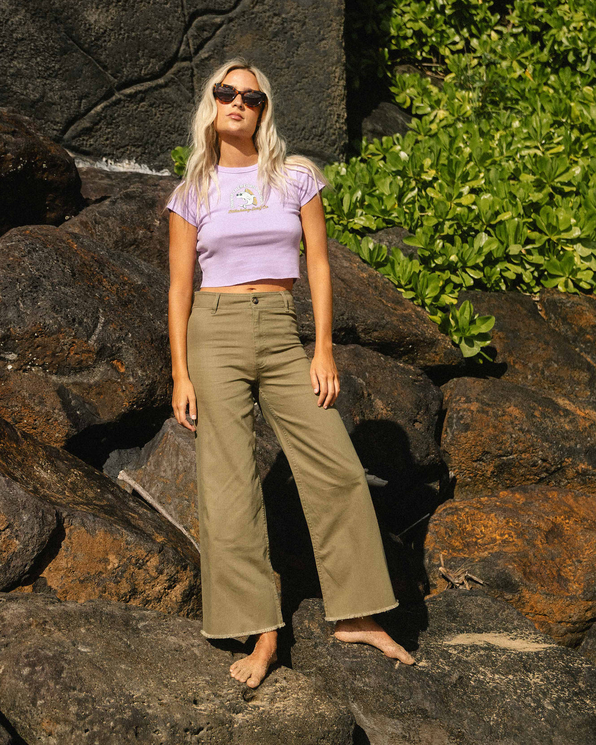 Martini olive high-waist twill pants with wide legs, shown on model wearing lavender crop top.