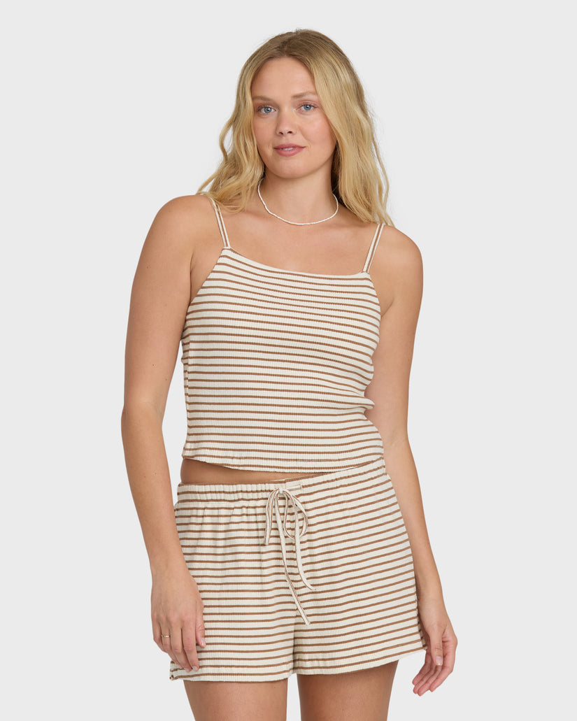 Brown and cream striped sleeveless tank top with thin shoulder straps on model.