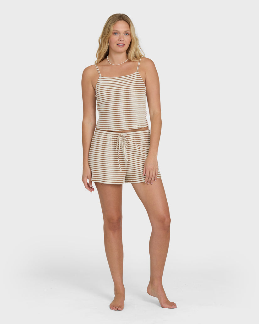 Brown and cream striped tank top with matching drawstring shorts on model.